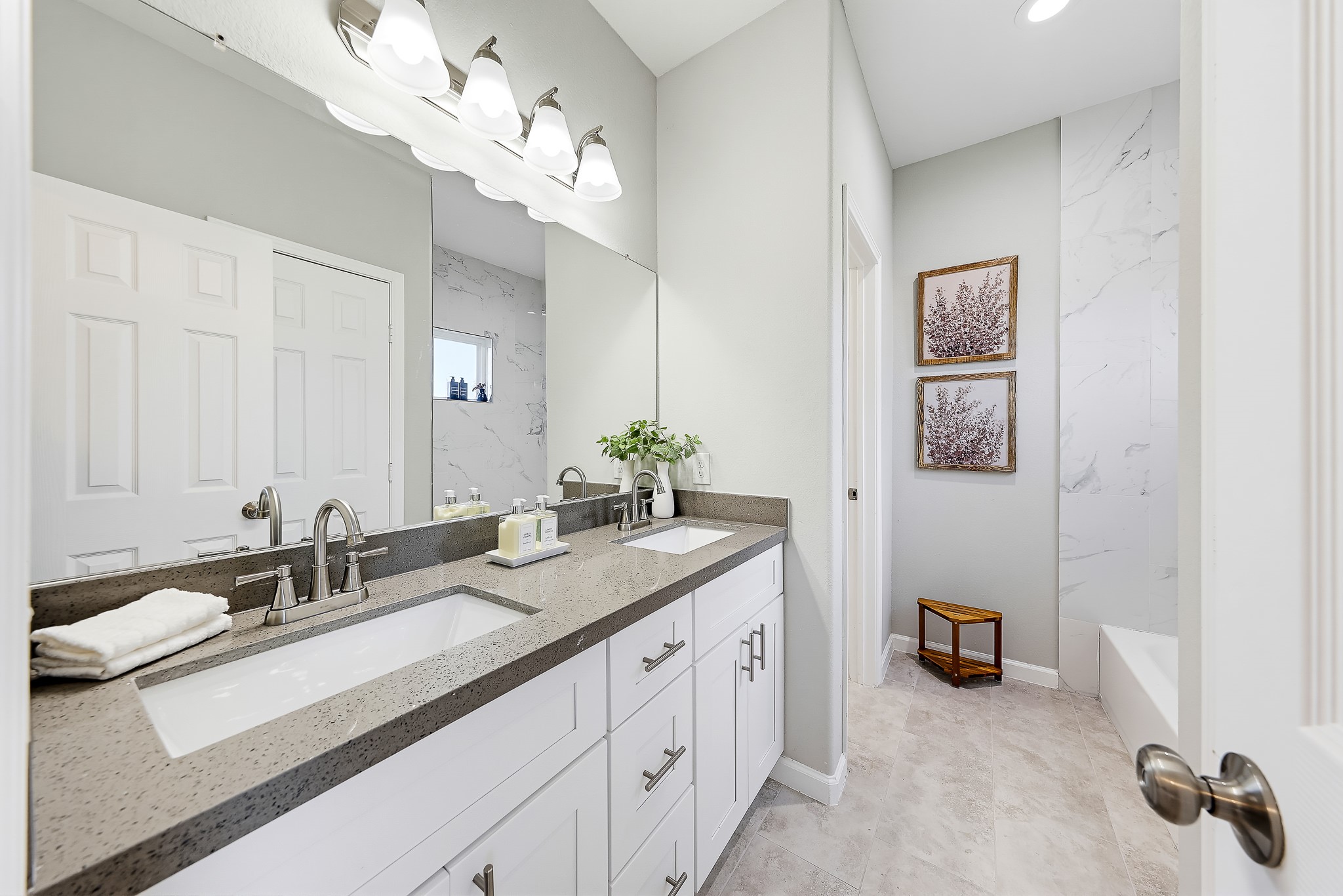 Two sinks and generous mirror space make getting ready together a little easier.