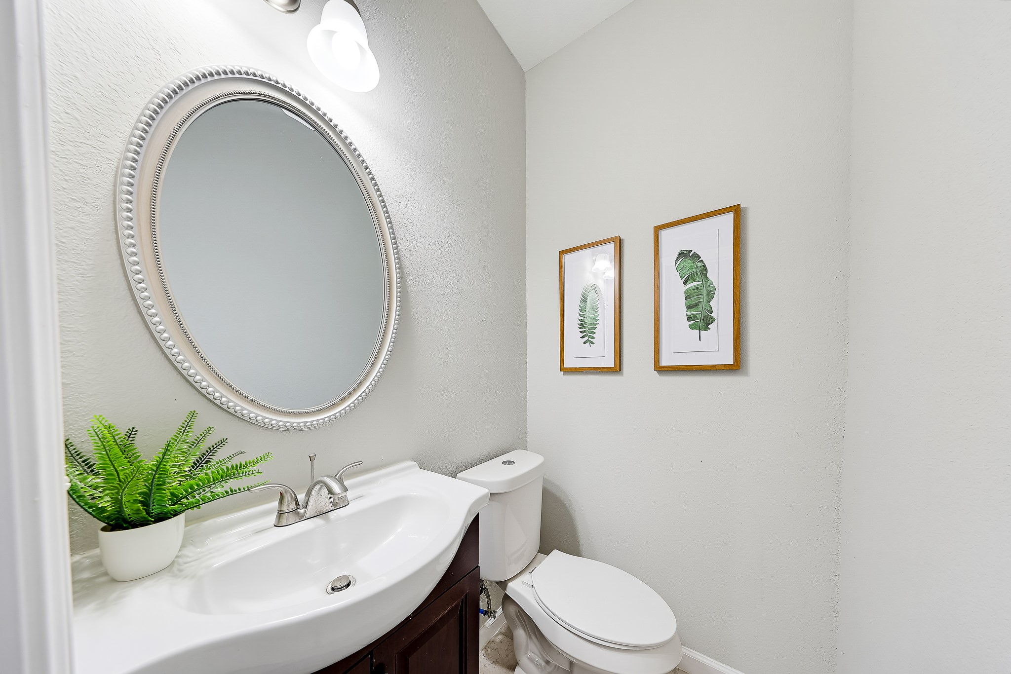 A conveniently located half bath gives guests a space of their own.