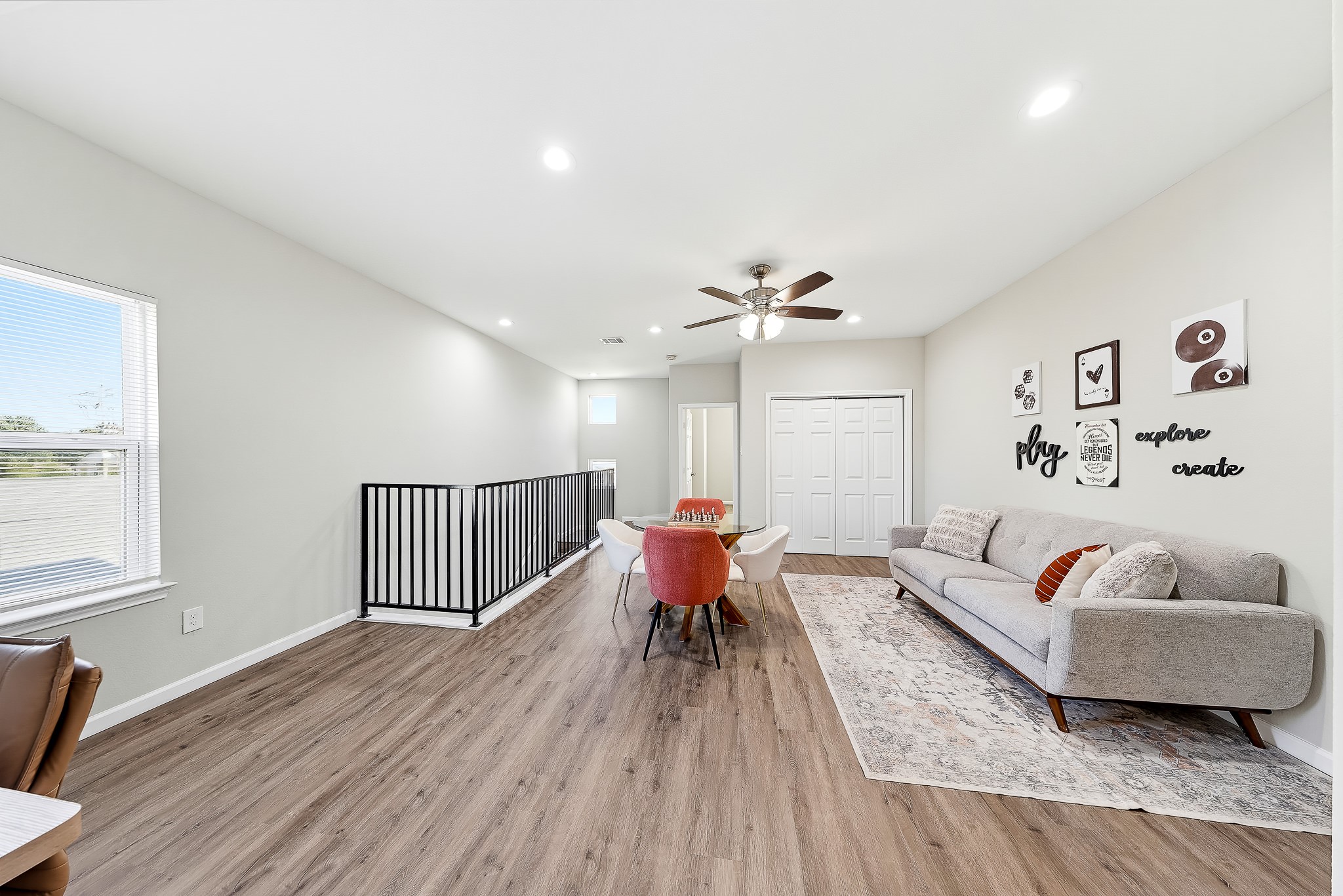 Create your favorite hangout with space for a game table, comfortable seating, and a desk.