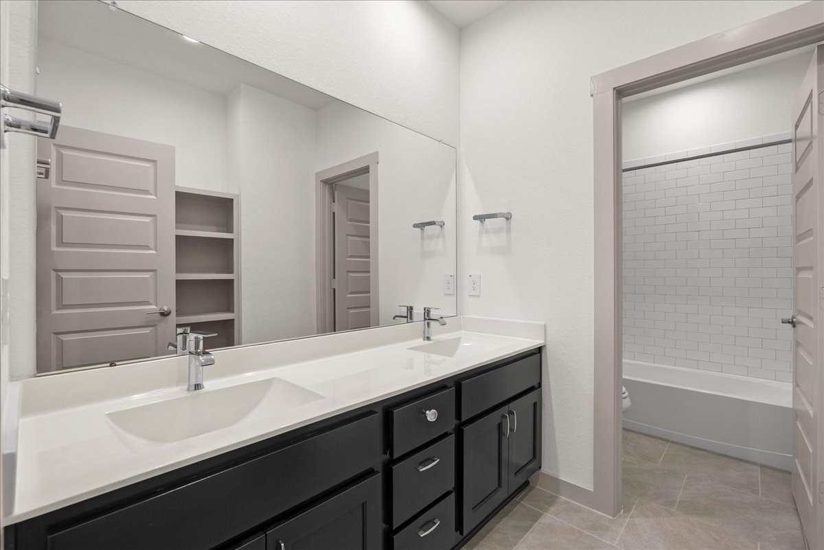 Two sinks make busy mornings easier in this spacious secondary bathroom.