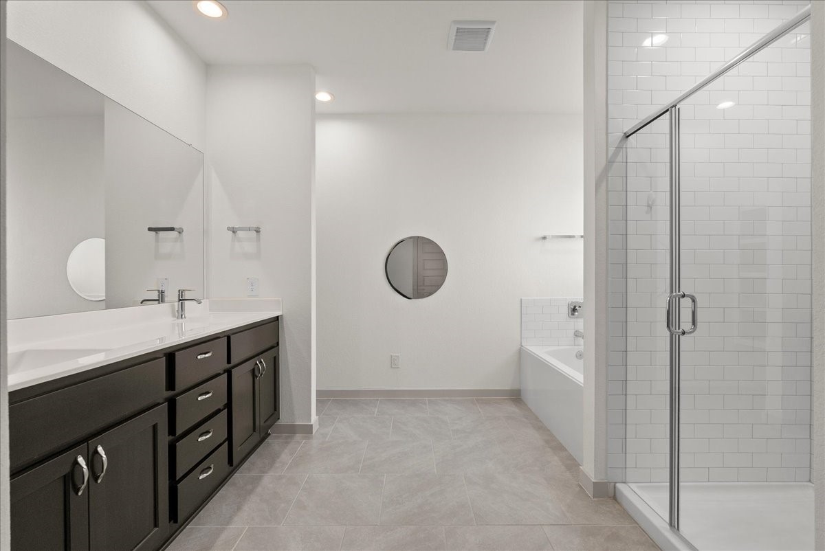 Your own private retreata spacious primary bathroom made for relaxing and recharging.