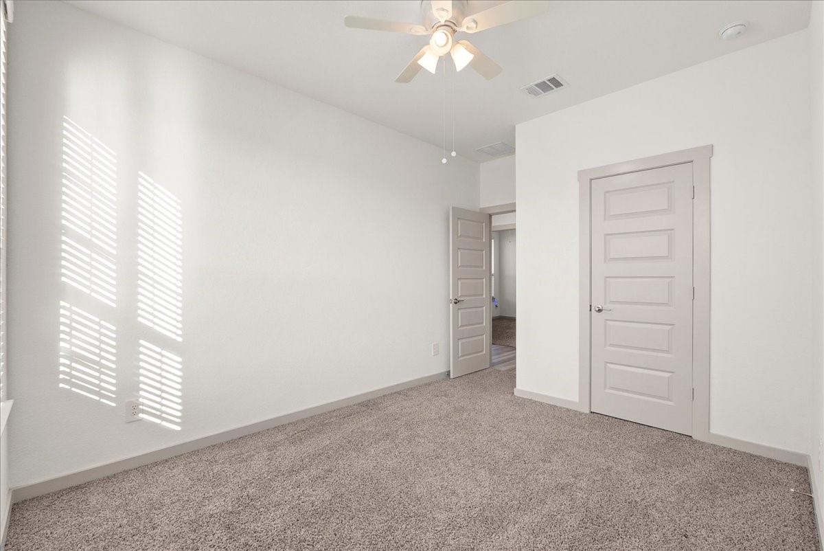 A comfortable secondary bedroom with plenty of space to make it your own.