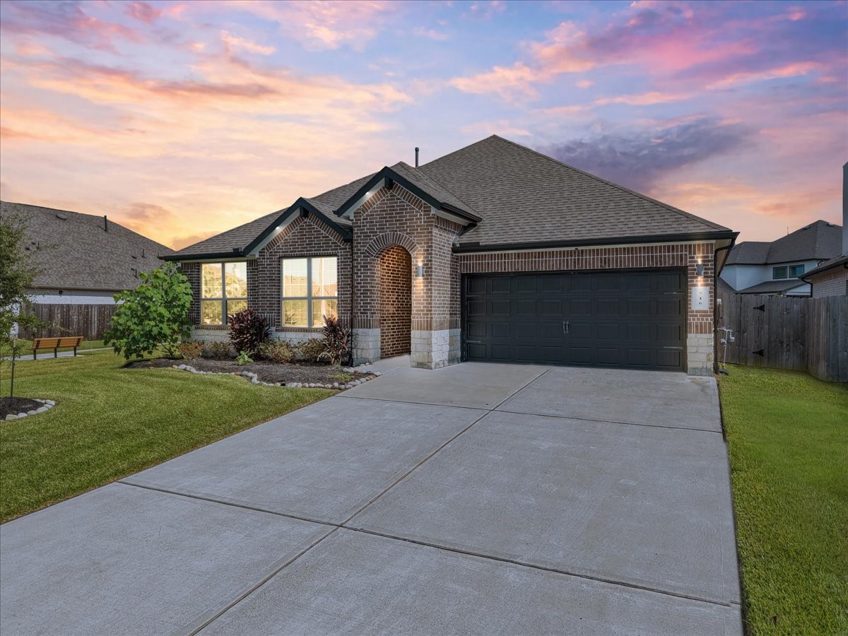 Charming home with a 3 car garage with lighting in the eaves