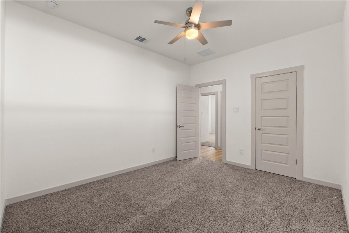Bright and inviting, this secondary bedroom offers flexibility for family or guests.