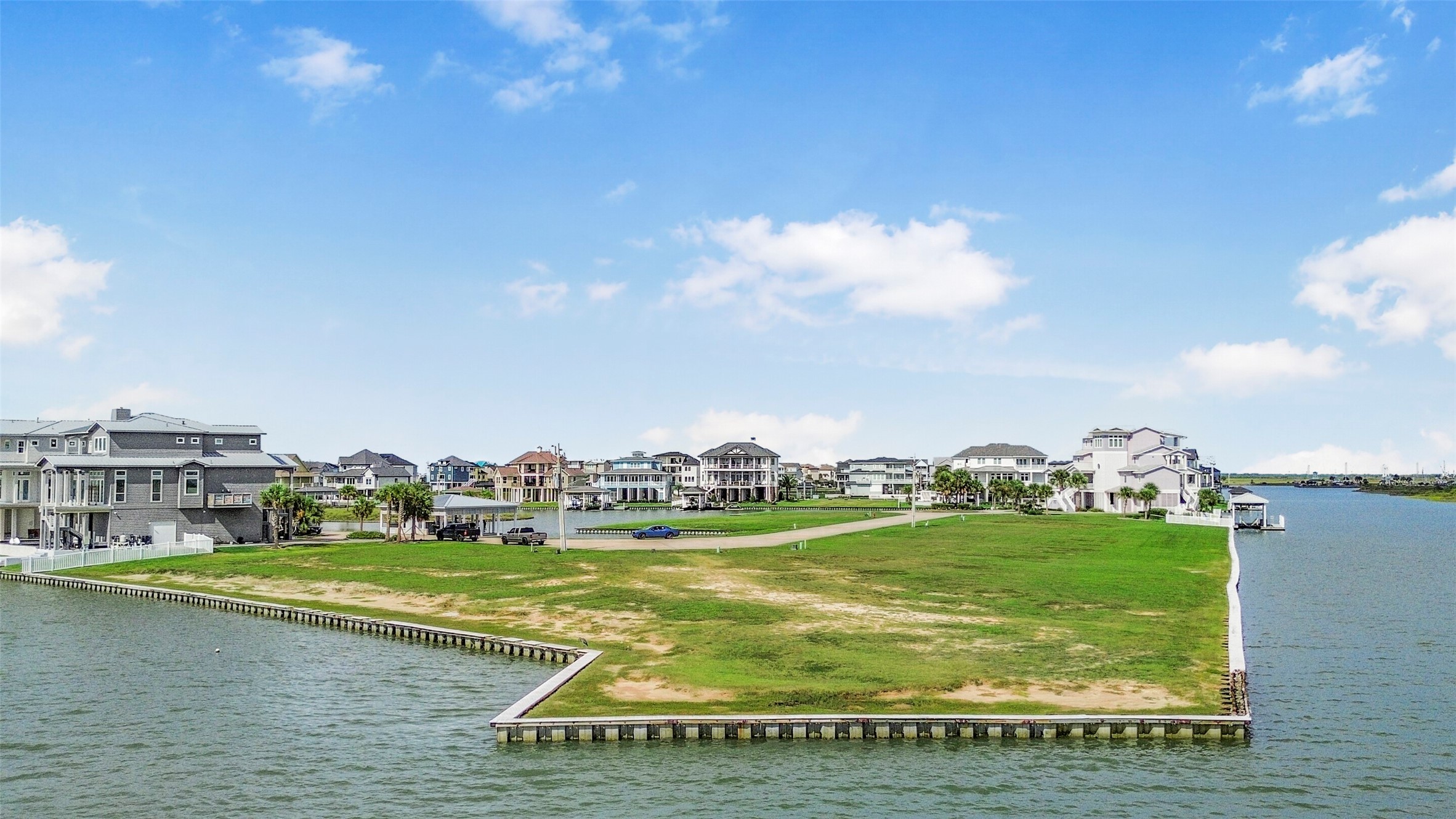 The canal front setting provides the perfect backdrop for a custom coastal home. With the bulkhead and boatlift already established, some of the waterfront infrastructure is already in place.