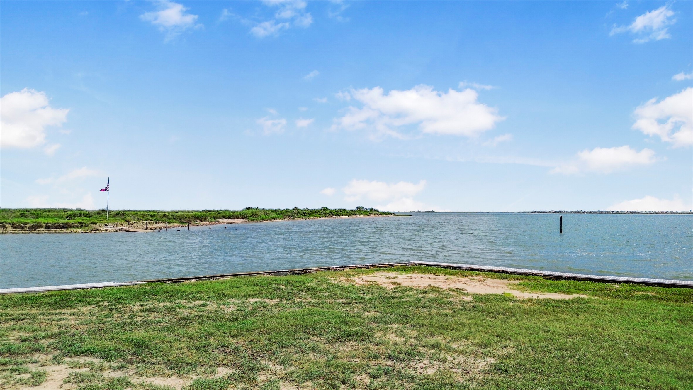 Cleared and ready for your vision, this HarborWalk lot offers a waterfront setting in one of the area's established gated boating communities. The existing boatlift lets you start enjoying the water before construction even begins.