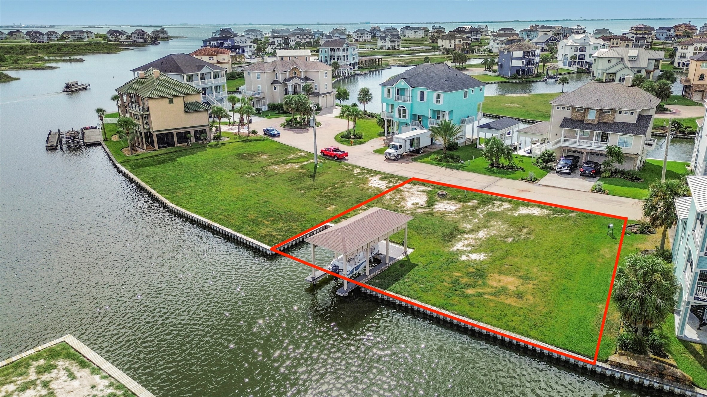 The fully constructed boatlift is included with the lot, adding immediate value for boating enthusiasts. Electricity and a fish cleaning station are already in place, making it easier to enjoy the waterfront while planning your future home.