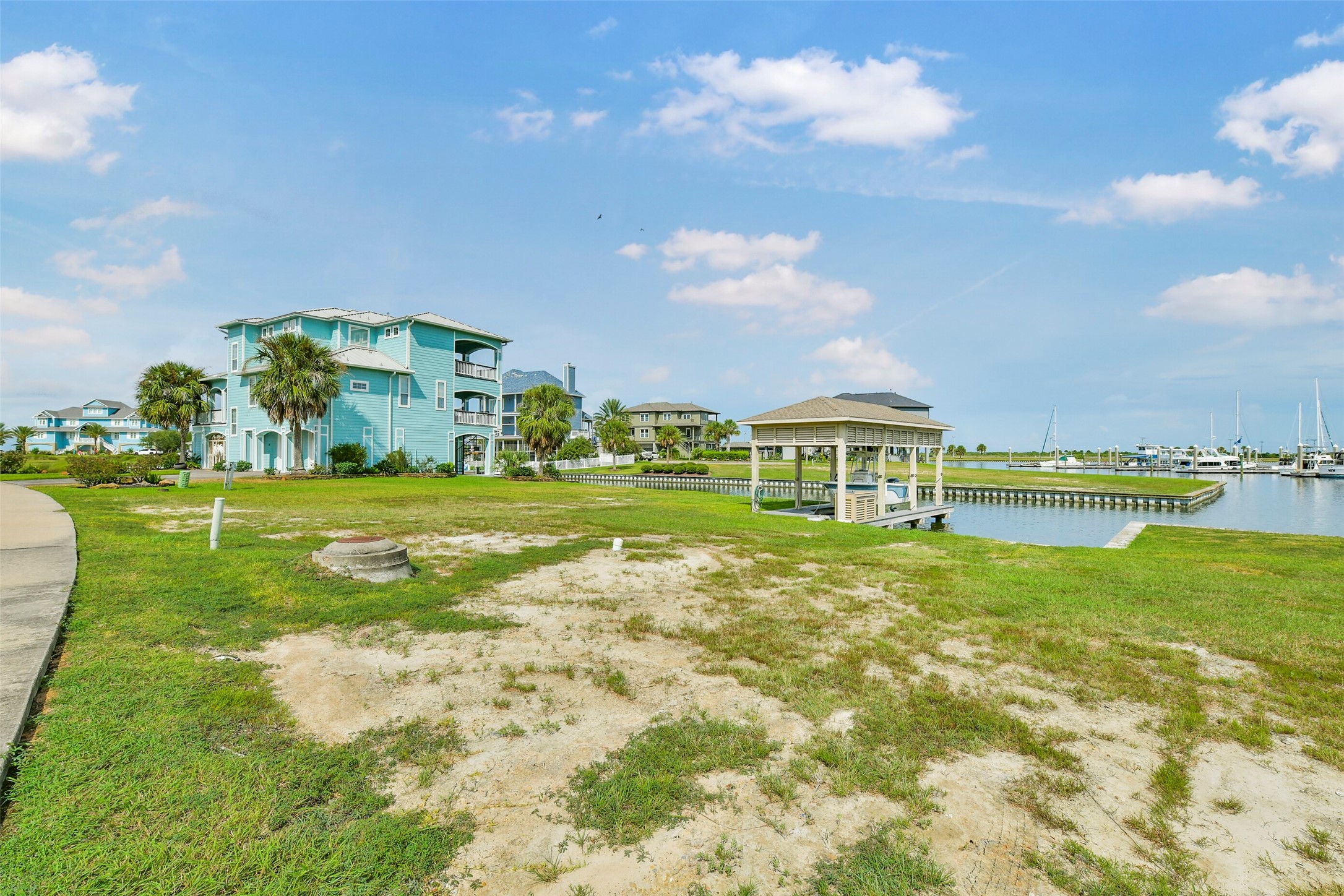 Picture your future custom home on this canal front HarborWalk lot with your boat just steps away. The fully constructed boatlift is already in place, giving you a head start on enjoying the waterfront lifestyle.