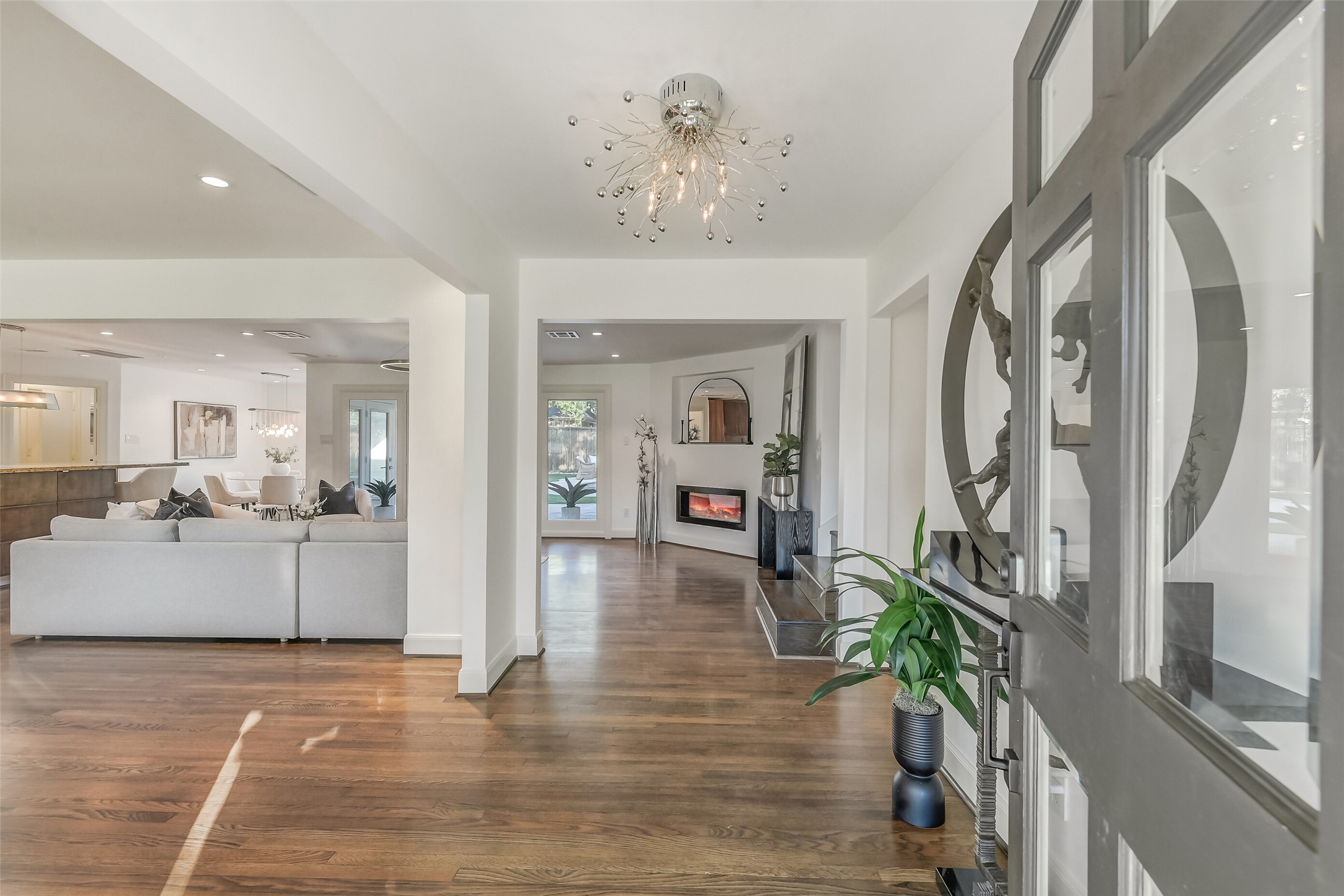 A warm welcome awaits! Step inside this beautifully updated home, where rich hardwood floors, contemporary finishes, and an open, light-filled design create an inviting atmosphere. A perfect blend of timeless charm and modern elegance.