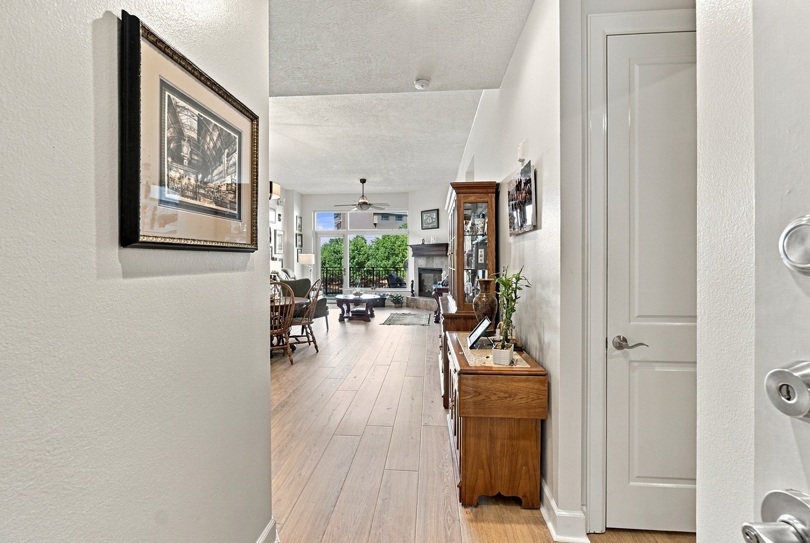 Welcoming entry with beautiful wood flooring and a seamless transition into the main living area.