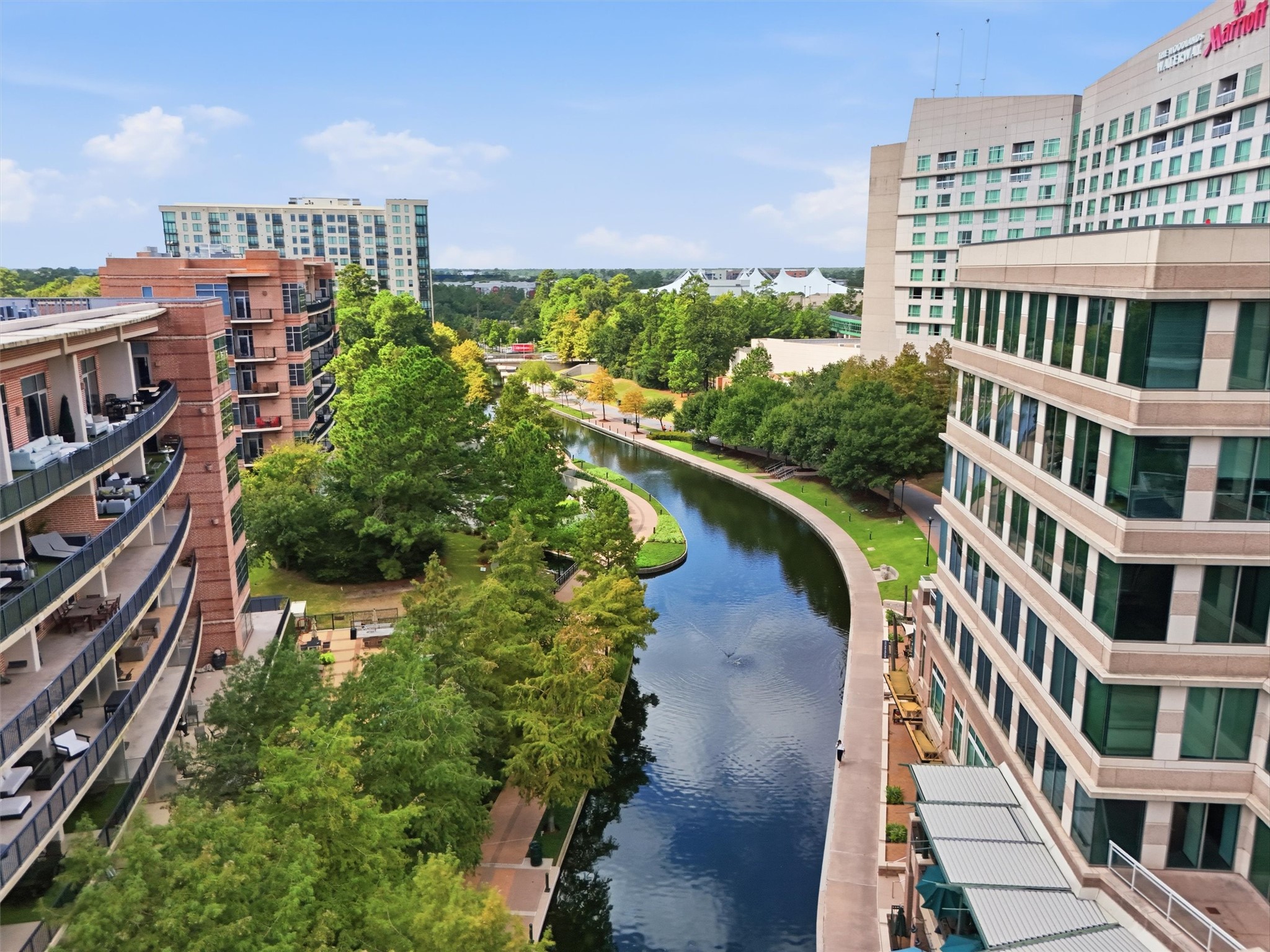 Enjoy a unique perspective of The Woodlands Waterway, surrounded by beautiful architecture and greenery.