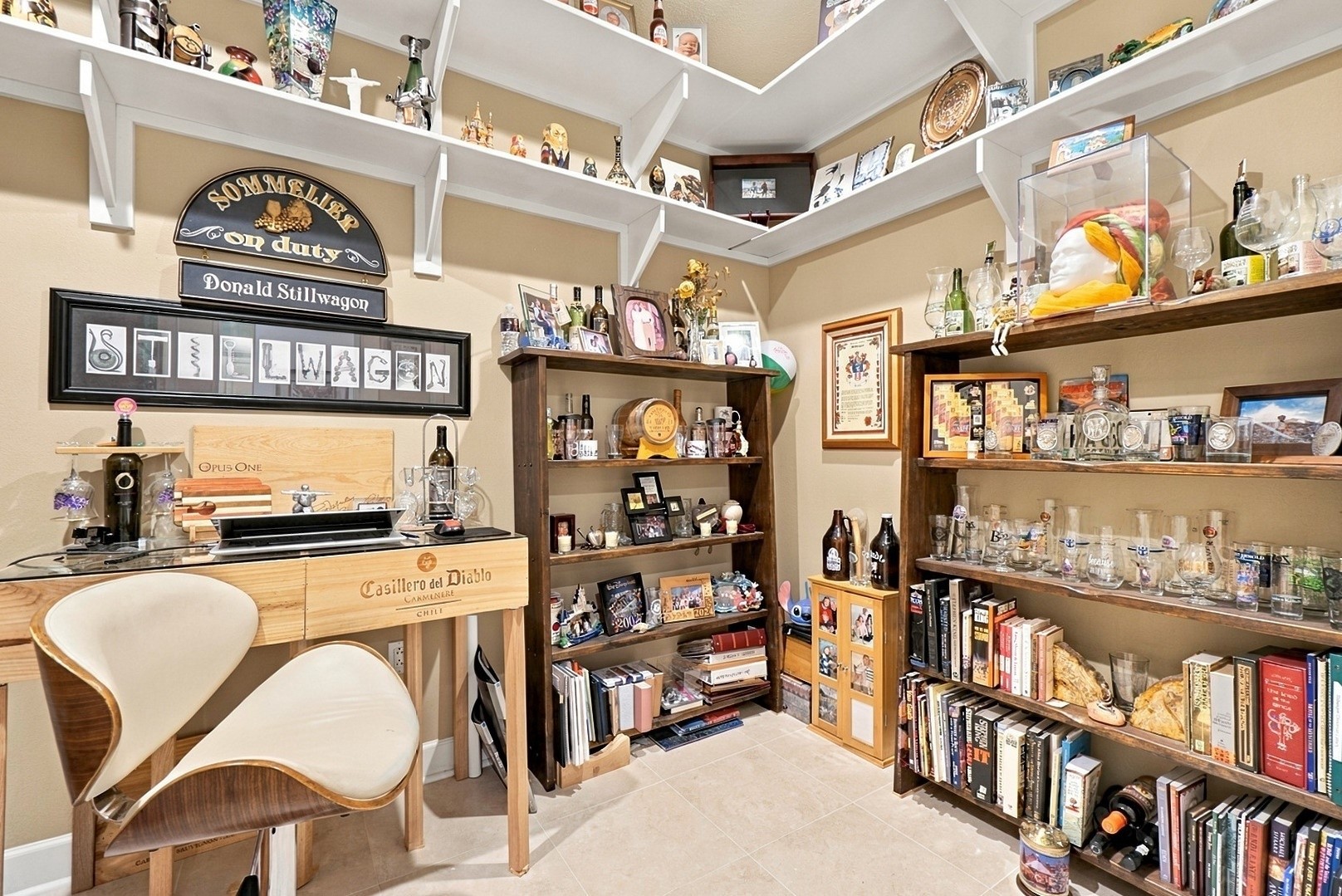 A distinctive library and home office featuring custom built-ins, abundant shelving, and timeless character.