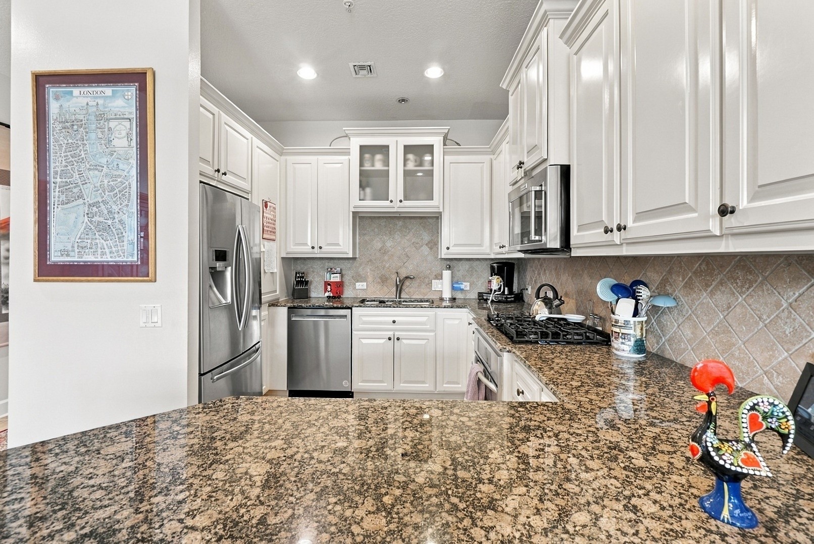 A well-appointed kitchen offering ample counter space, classic finishes, and functional design.