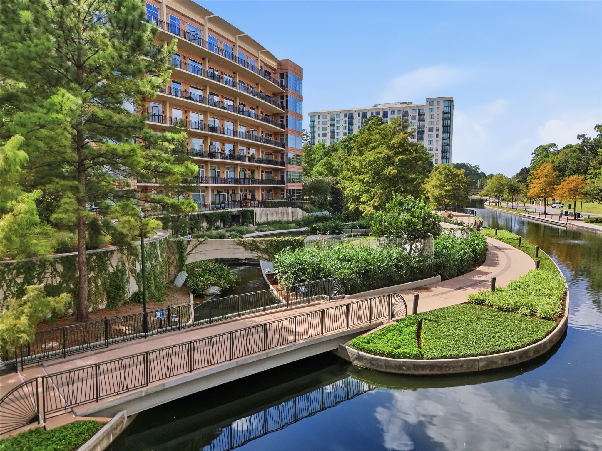 A picturesque combination of waterfront scenery, manicured landscaping, and urban convenience.