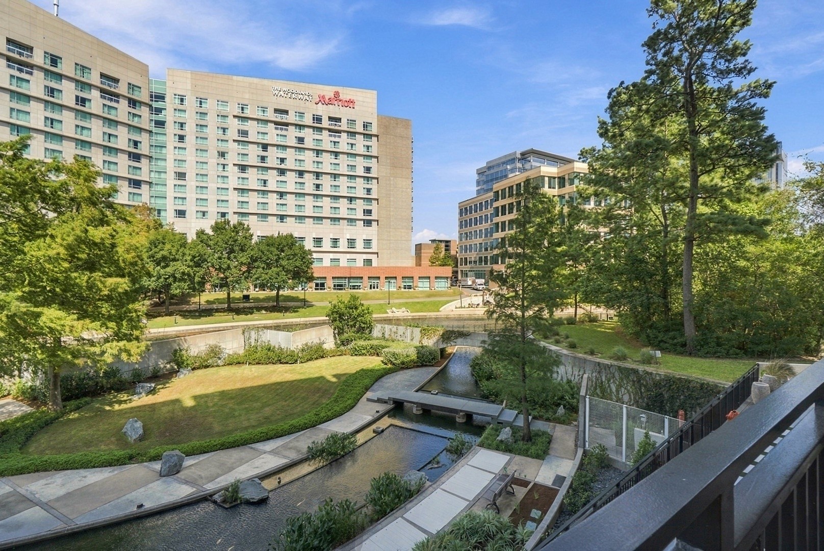 Beautifully landscaped grounds and winding walking paths create a peaceful setting along the Waterway and check out that Koi Pond!
