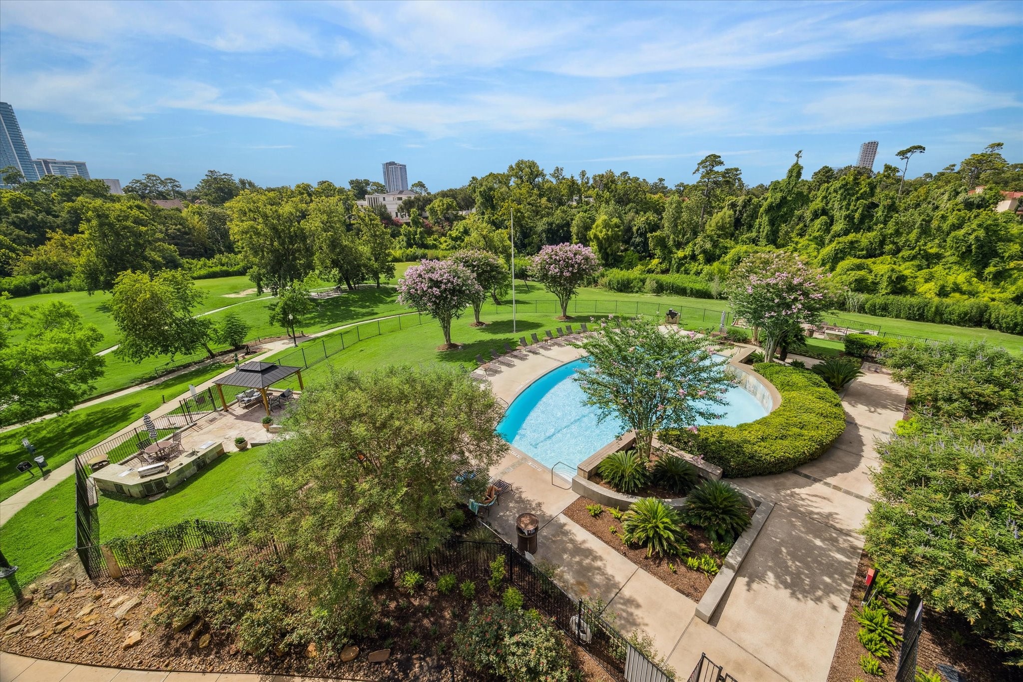 Lap pool with lots of tranquil green space.