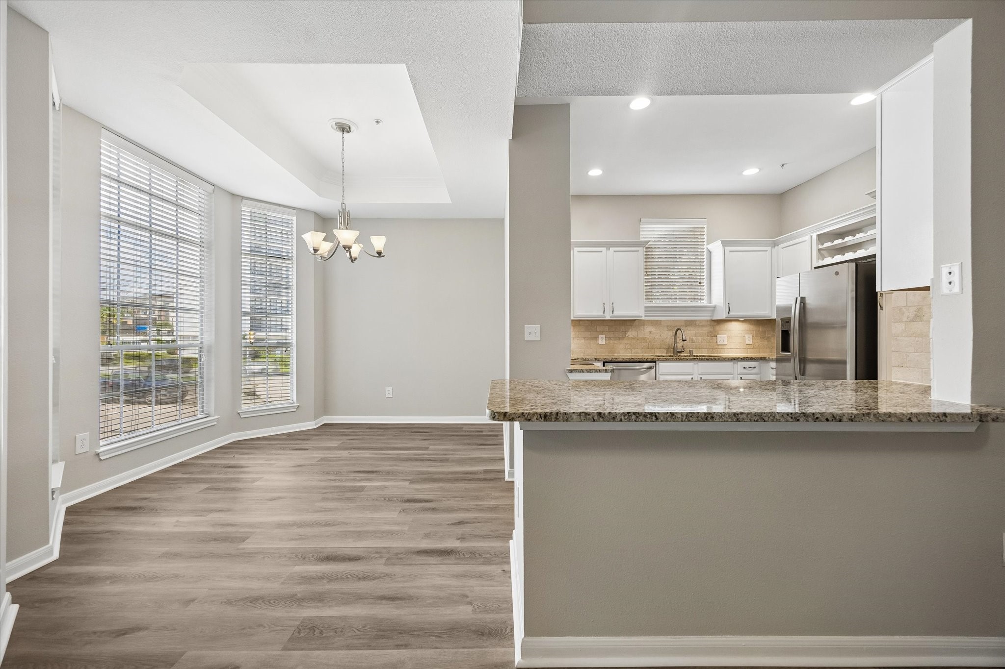 Dining area can easily accommodate a formal dining table.