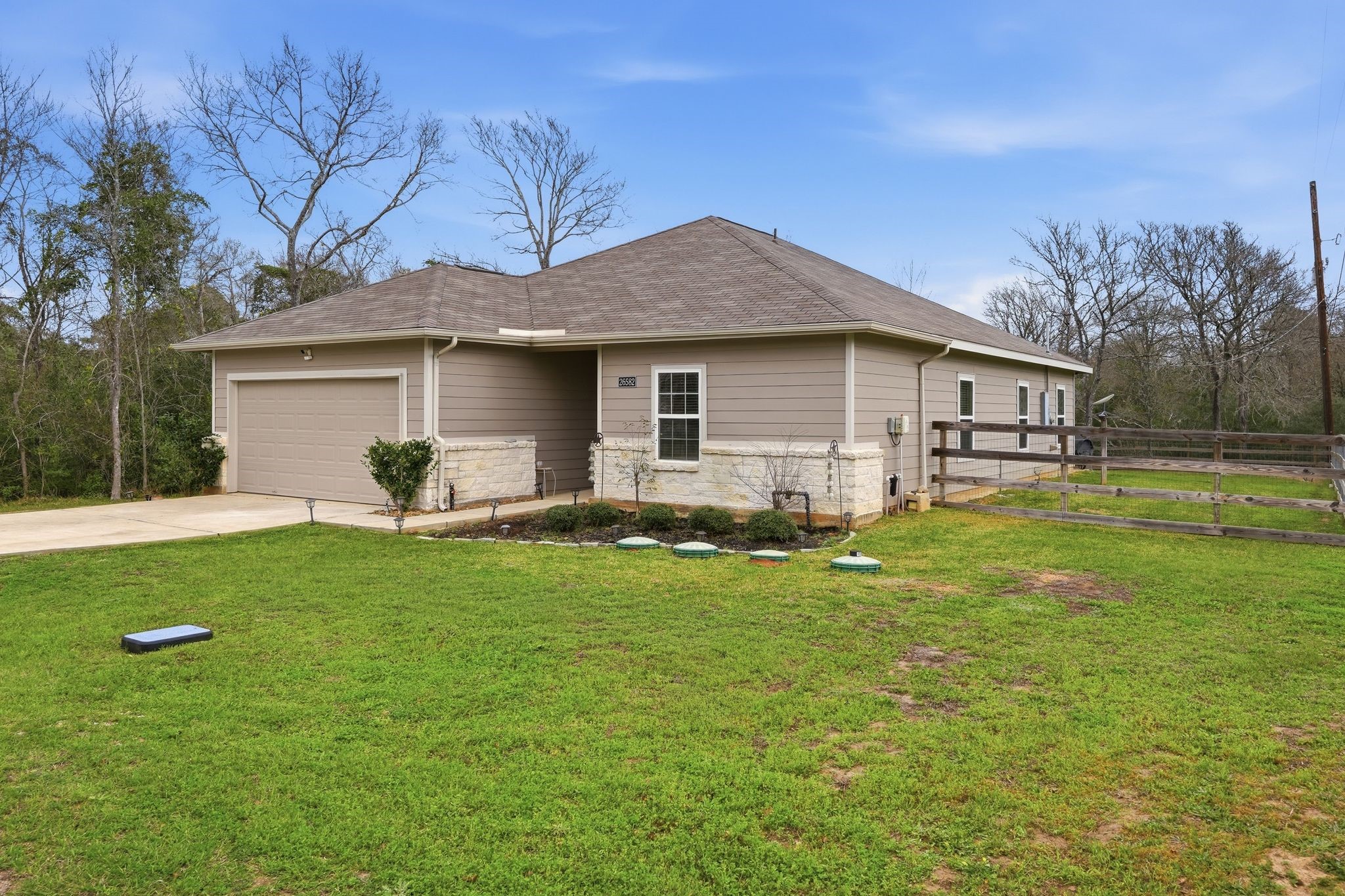 Home has a fenced in backyard on a large lot