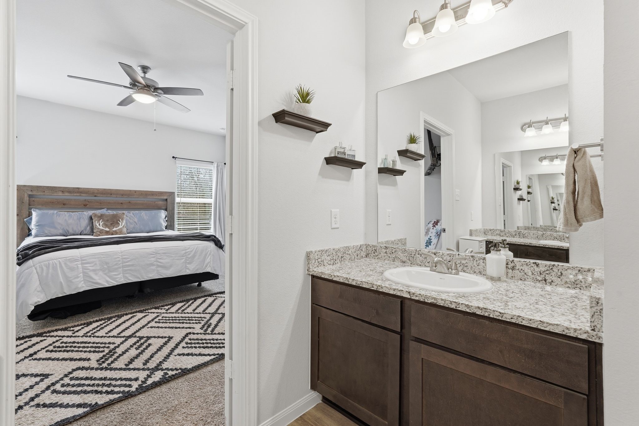 Large primary bathroom with double sinks and a shower and tub