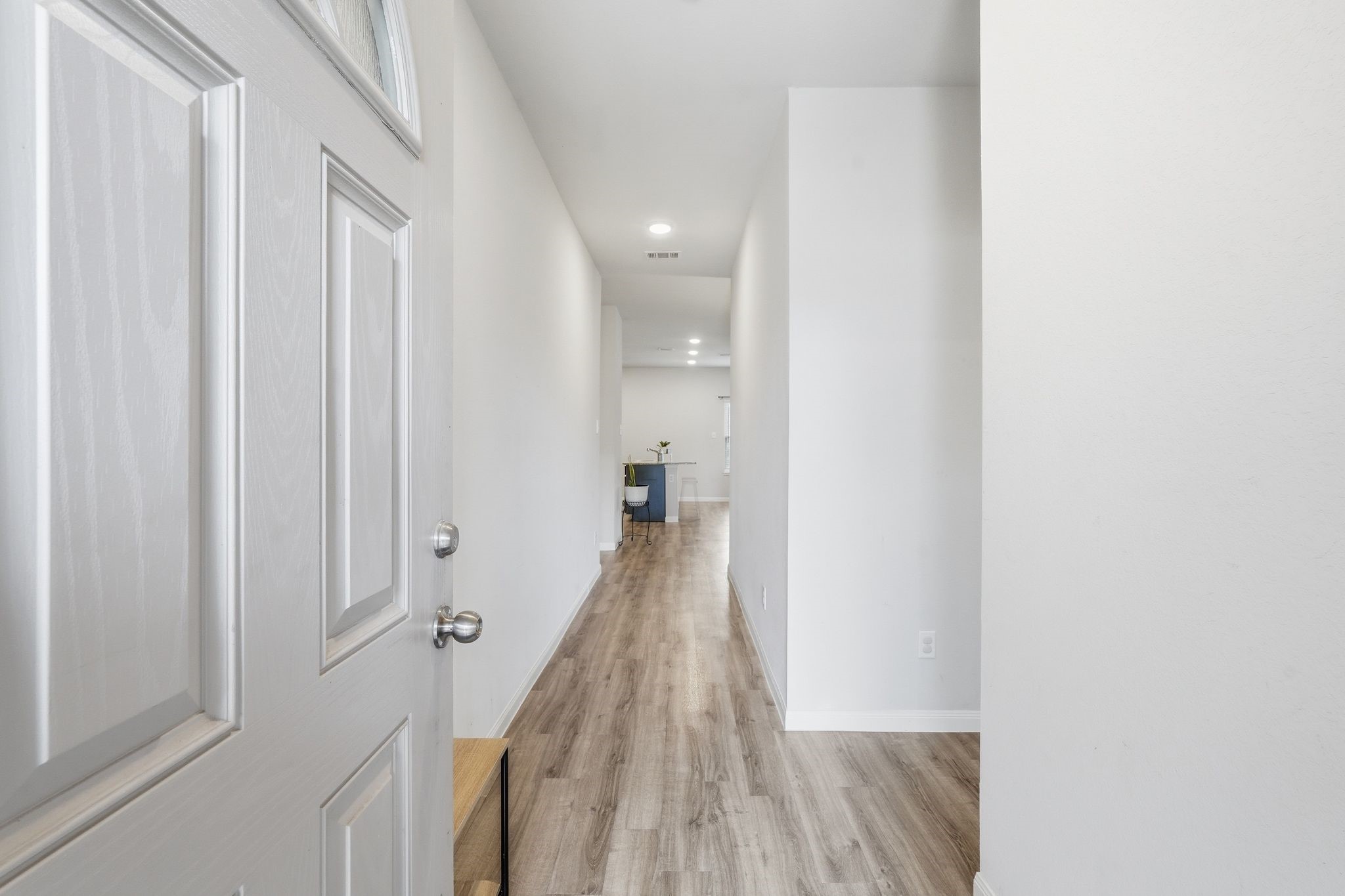 As you enter the home you are welcomed with natural lighting and beautiful flooring