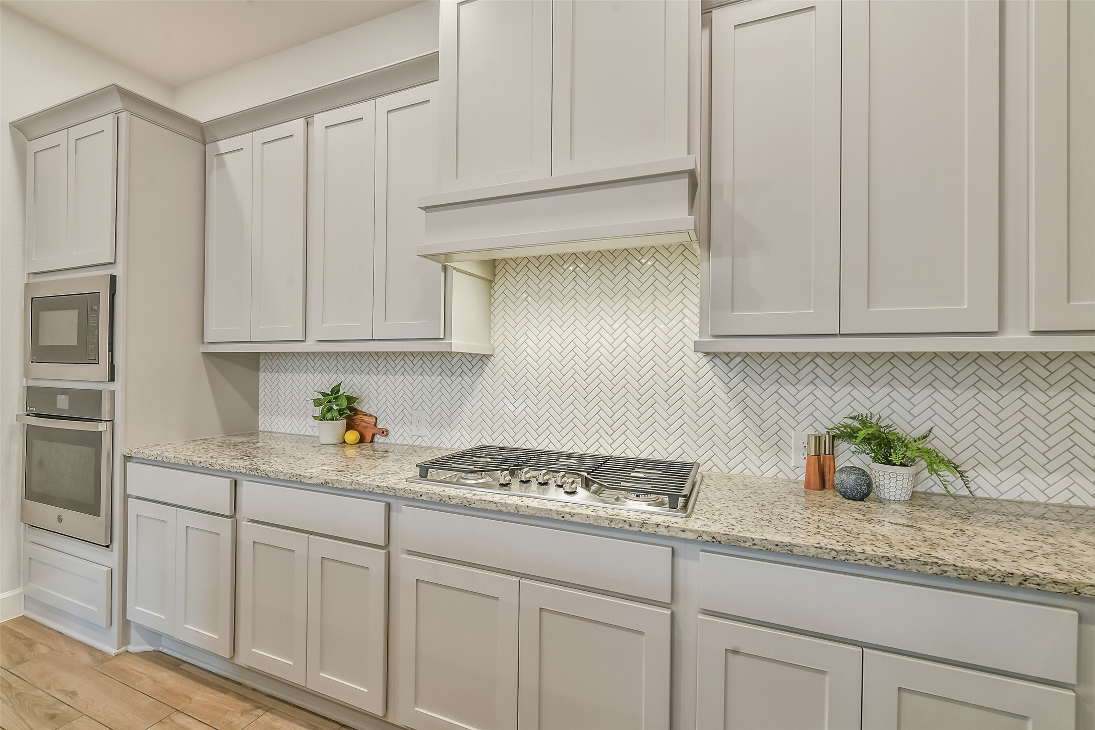 The designer backsplash adds to the beauty of this home.