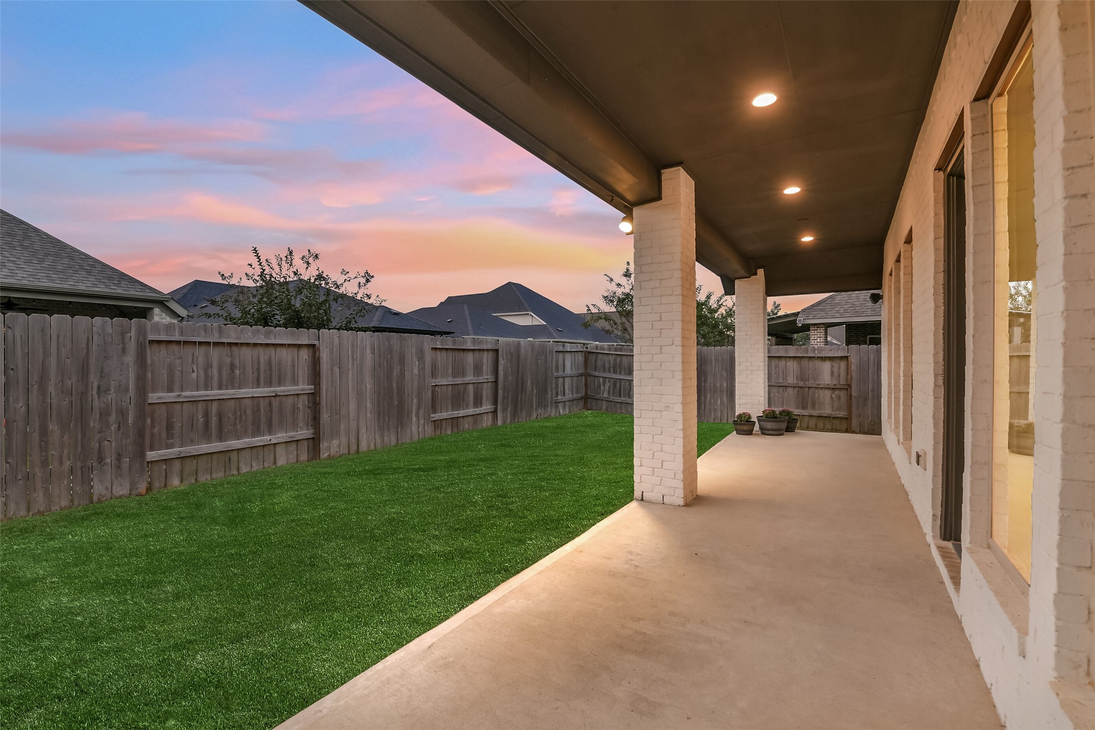 The covered porch stretches the entire lenght of the home.