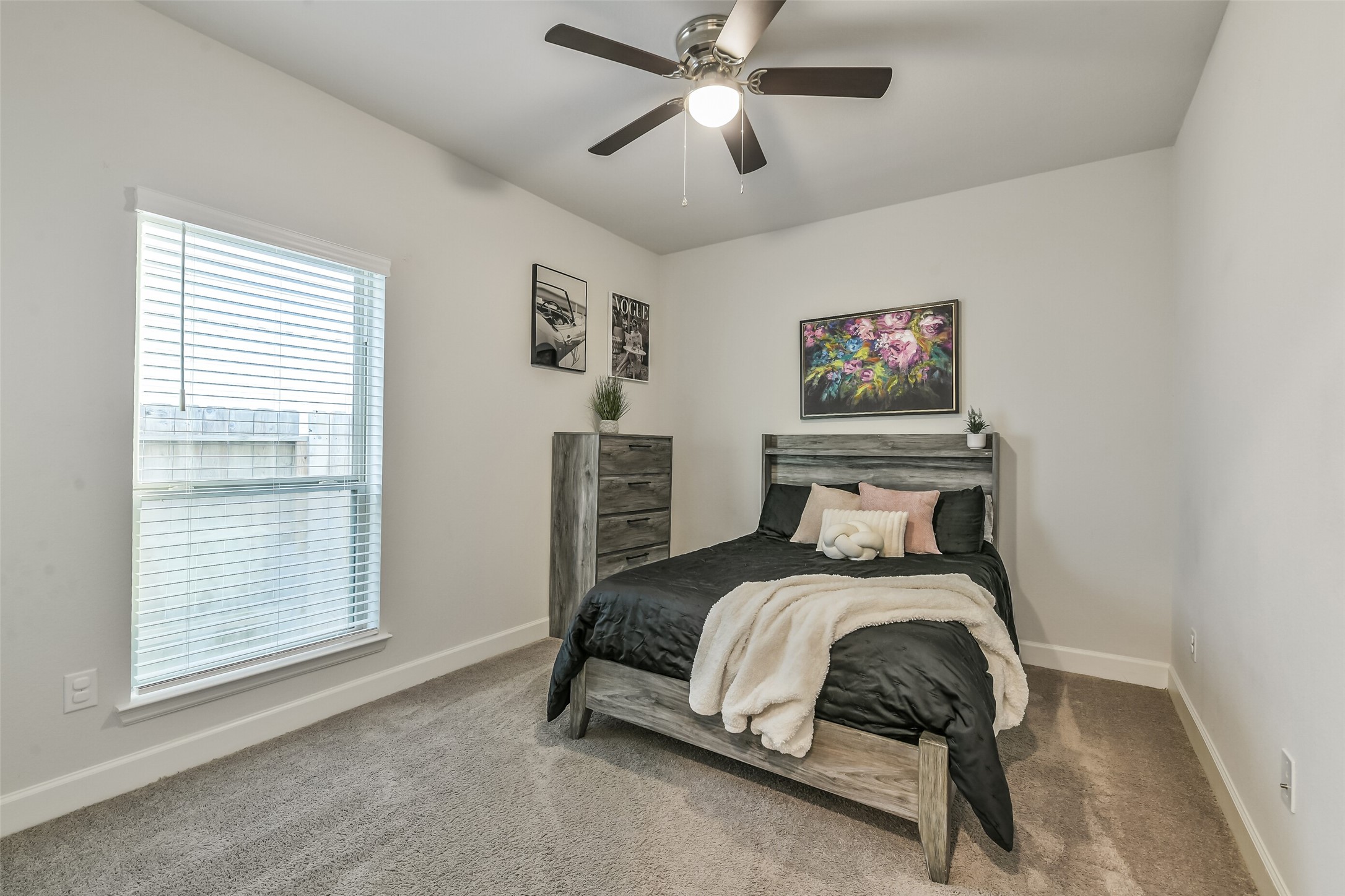 Secondary bedroom #2 features a ceiling fan.