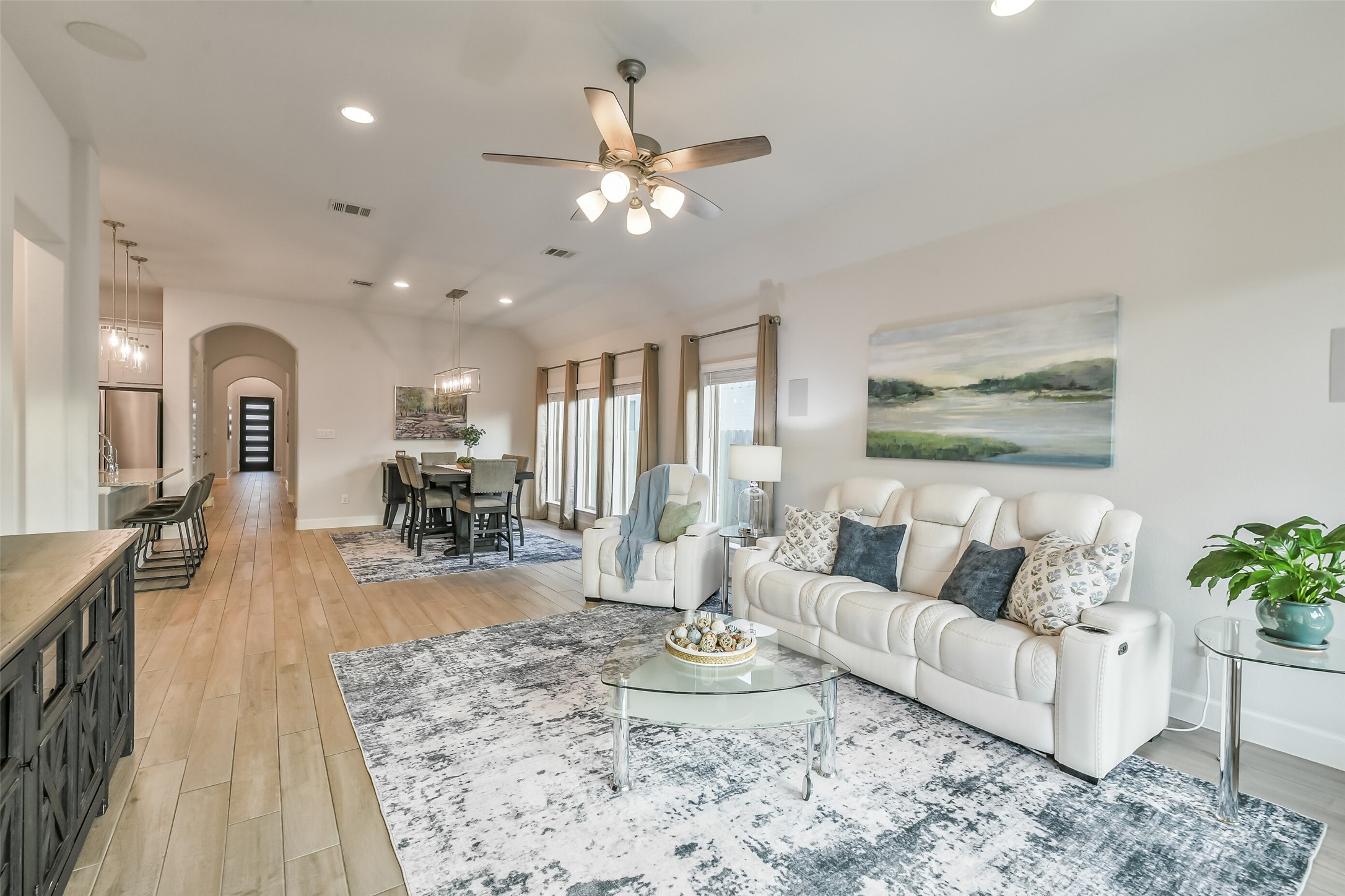 Gorgeous tile flows throughout the entry, kitchen, dining, and living spaces.