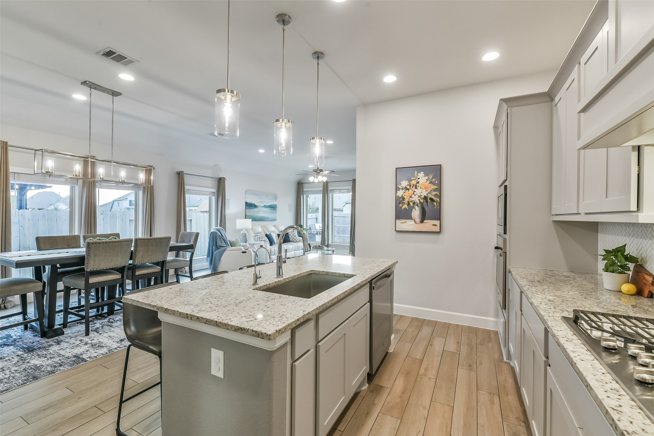 The open floor plan allows the kitchen, dining area and living room to flow together.