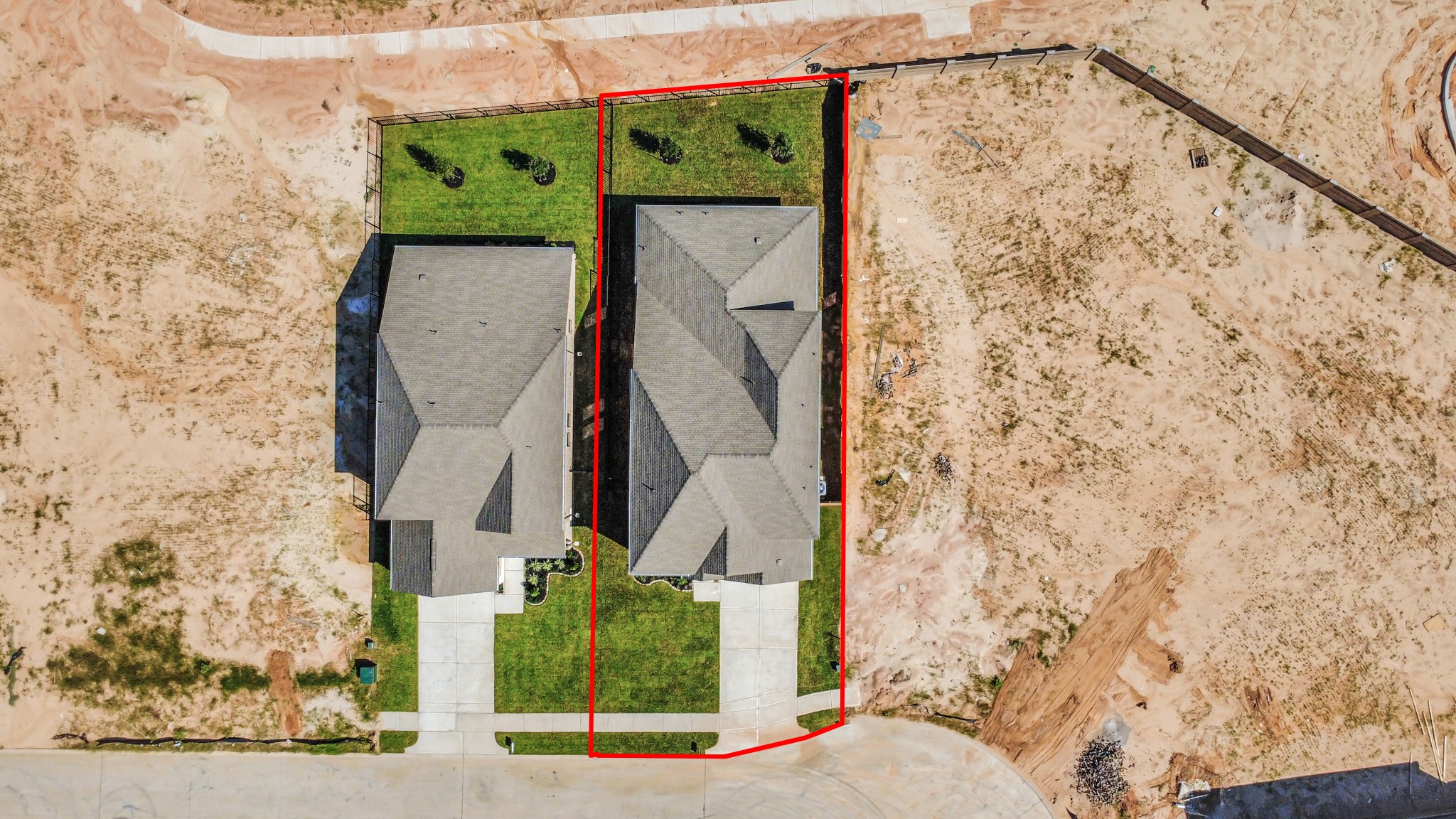 An aerial view of a spacious subdivision lot, highlighting a well-maintained yard and a fully fenced perimeter, offering both privacy and expansive outdoor space. An aerial view of a spacious subdivision lot, highlighting a well-maintained yard and a fully fenced perimeter, offering both privacy and expansive outdoor space.