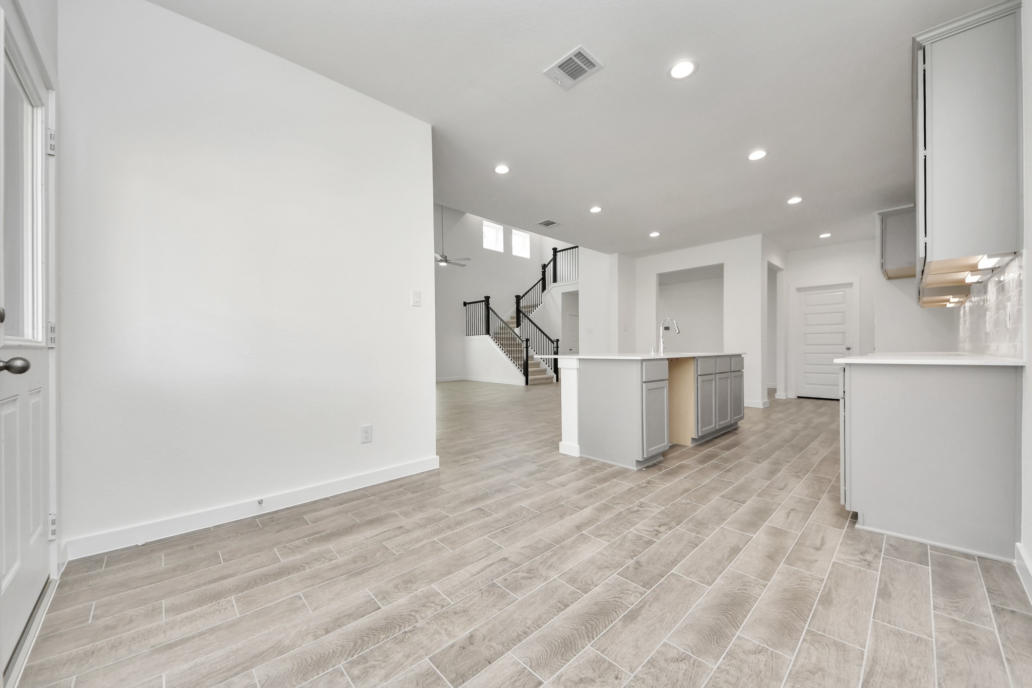Enjoy breakfast with ease in the connected and cozy breakfast area, seamlessly integrated with the kitchen for utmost convenience. Step through the back door for a breath of fresh air onto the covered patio, extending your living space to the outdoors. Sample photo of completed home with similar floor plan. Actual colors and selections may vary.