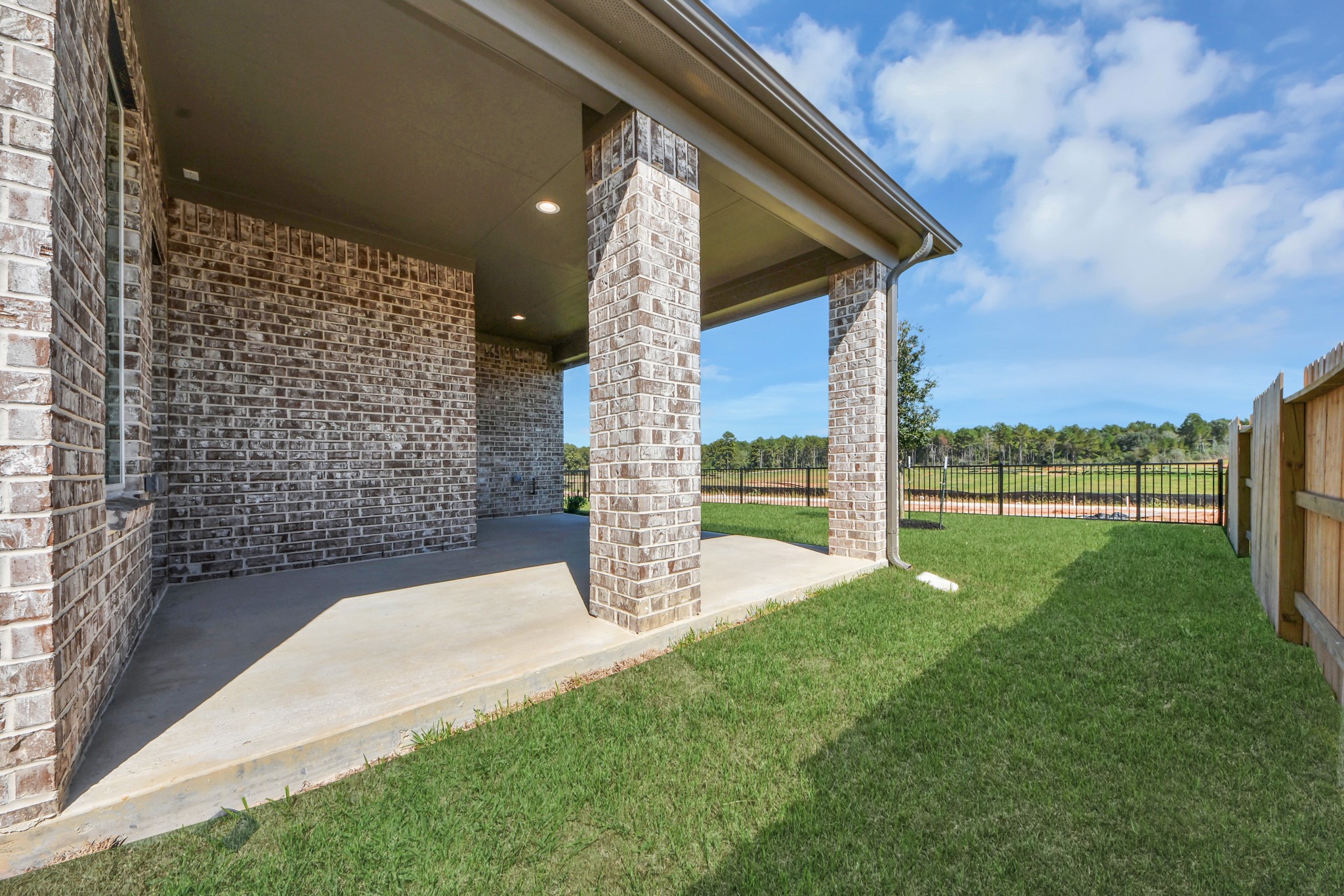 Come and see this spacious backyard with its beautiful covered patio. There is plenty of room for the kids to play and adults to relax. Perfect for your outdoor living space, patio furniture, bbq pit, and so much more. The possibilities are endless!