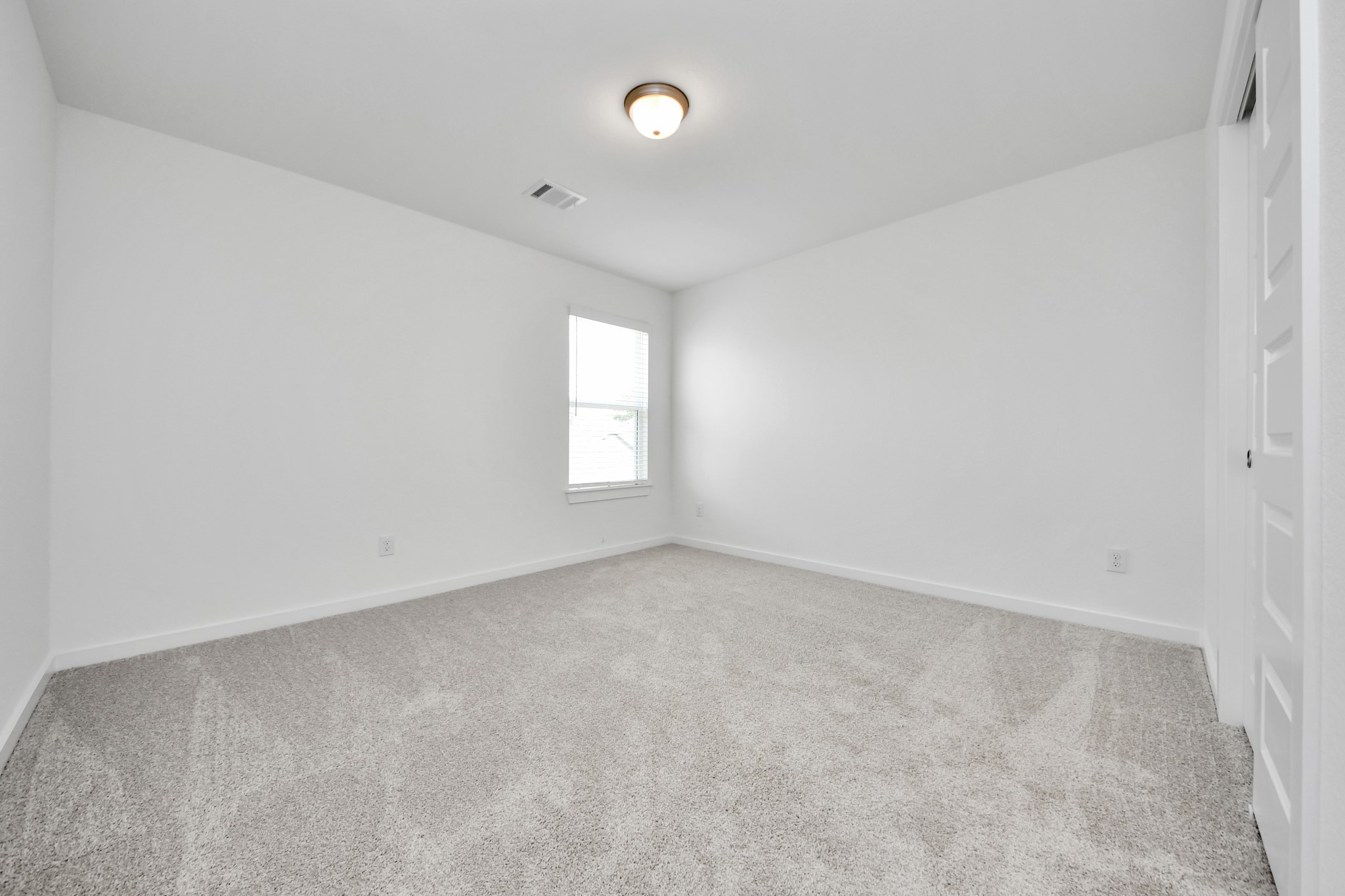Generously sized secondary bedrooms featuring spacious closets, soft and inviting carpeting underfoot, large windows allowing plenty of natural light, and the added touch of privacy blinds for your personal retreat. Sample photo of completed home with similar floor plan. Actual colors and selections may vary.