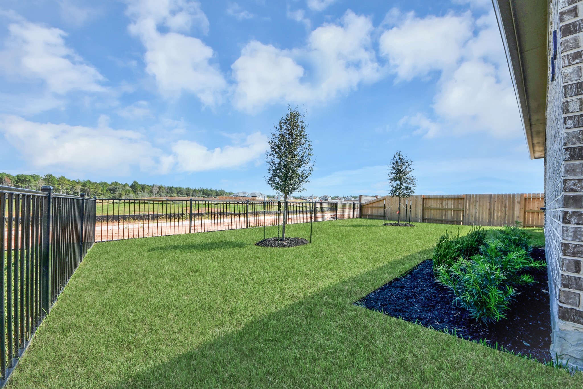 Experience outdoor living at its finest on this expansive covered patio, thoughtfully designed for BBQs and delightful outdoor dining.