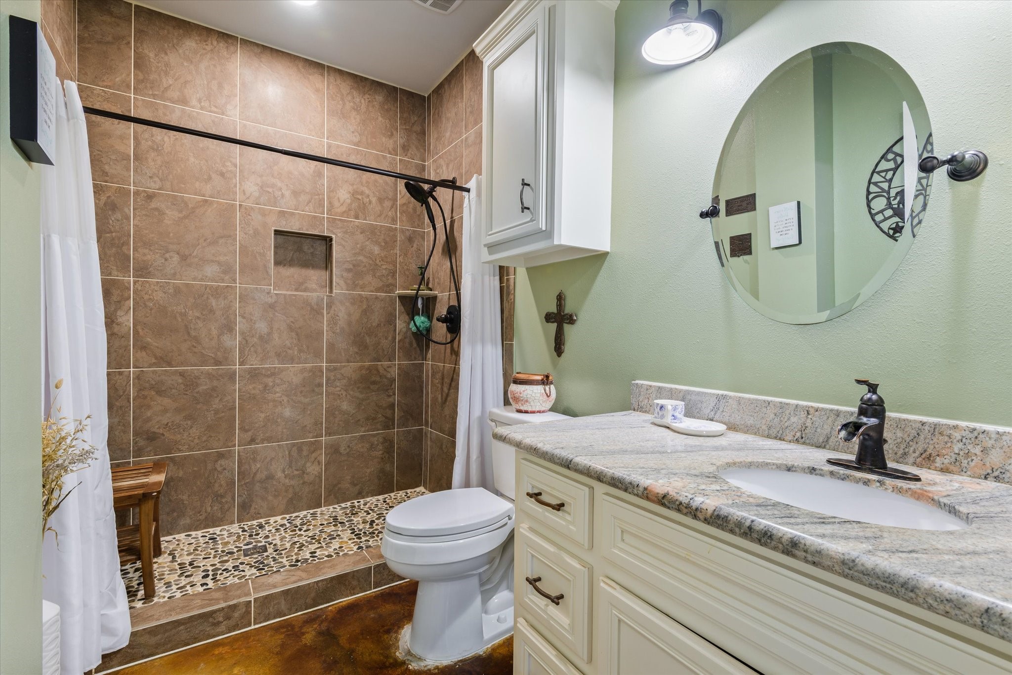 Primary bathroom with oversized tile shower.