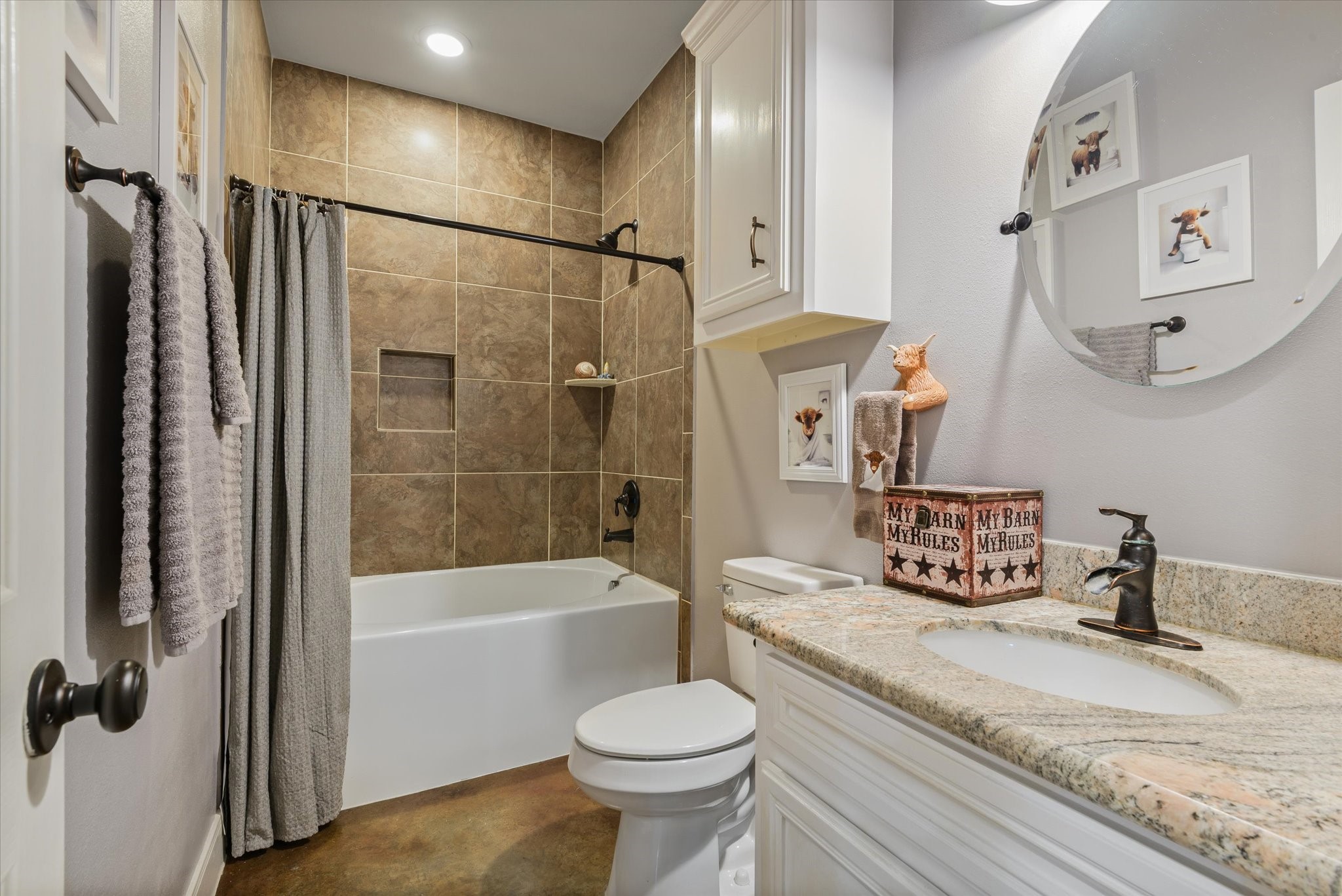 Common bathroom with soaking tub/shower combo.
