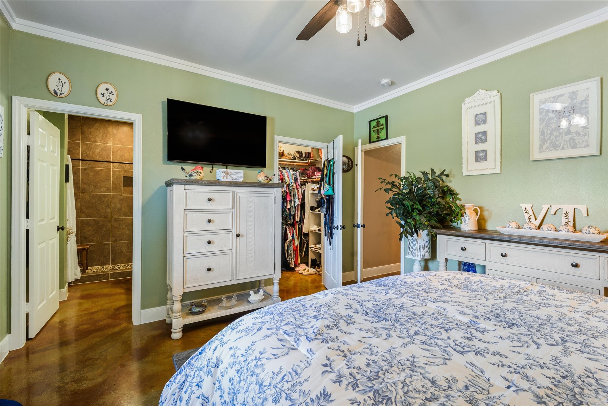 Primary bedroom with access to en-suite bathroom and walk in closet.