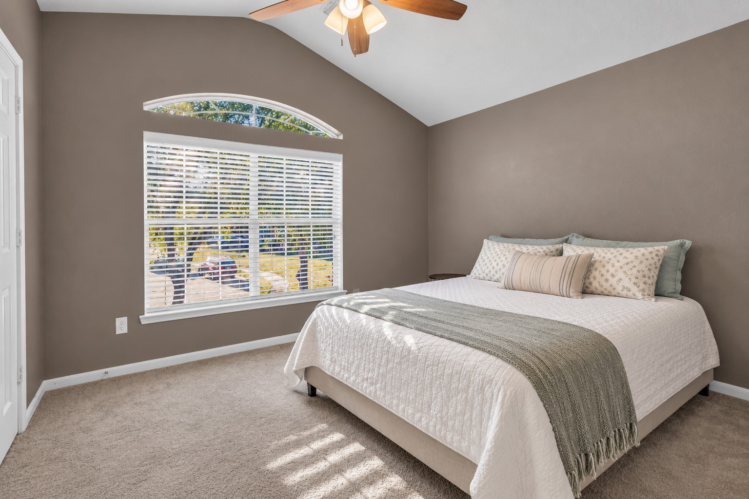 What a window in this secondary bedroom. Great paint selections throughout.