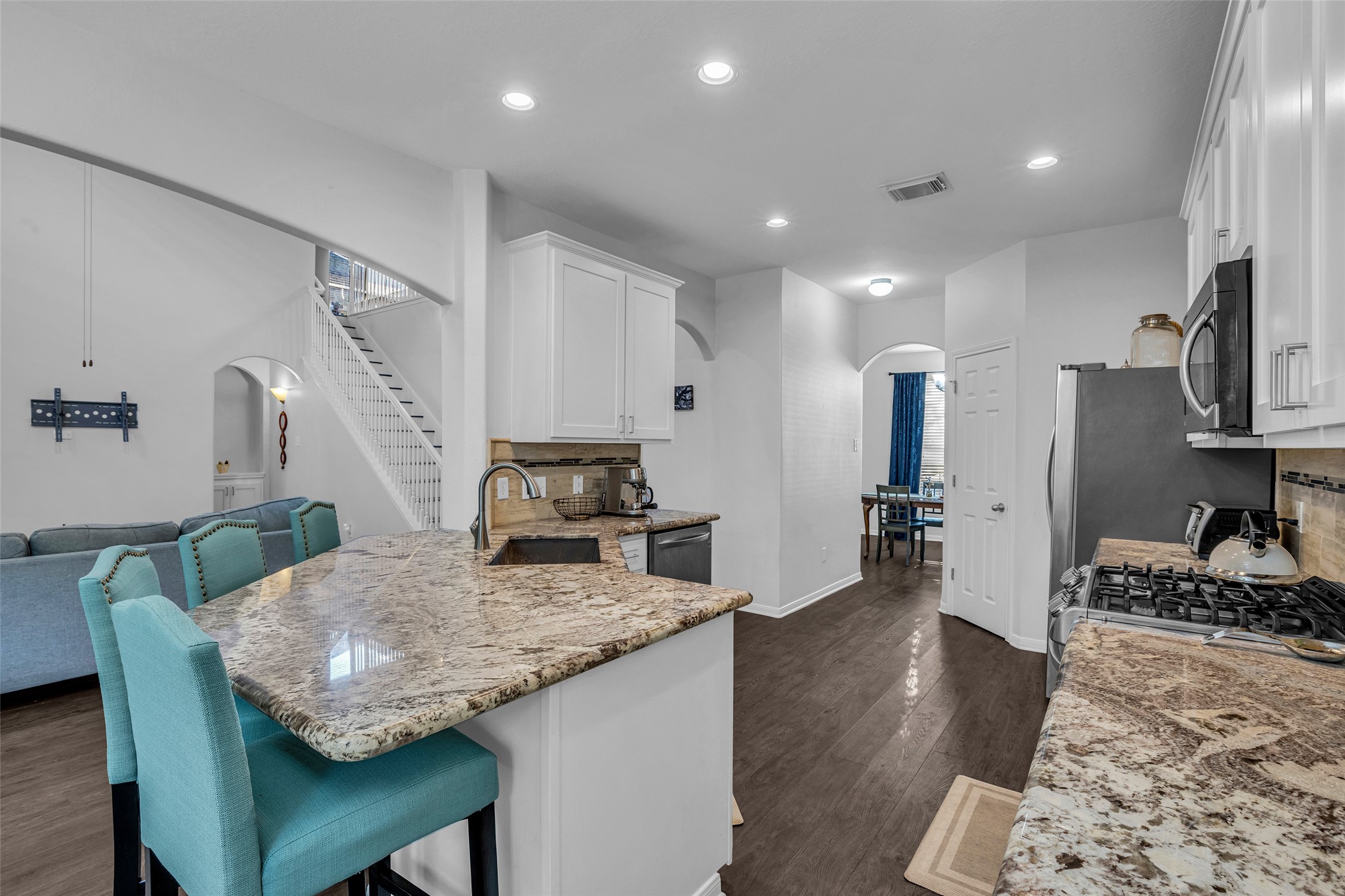 Beautiful granite counters and plenty of cabinet space.