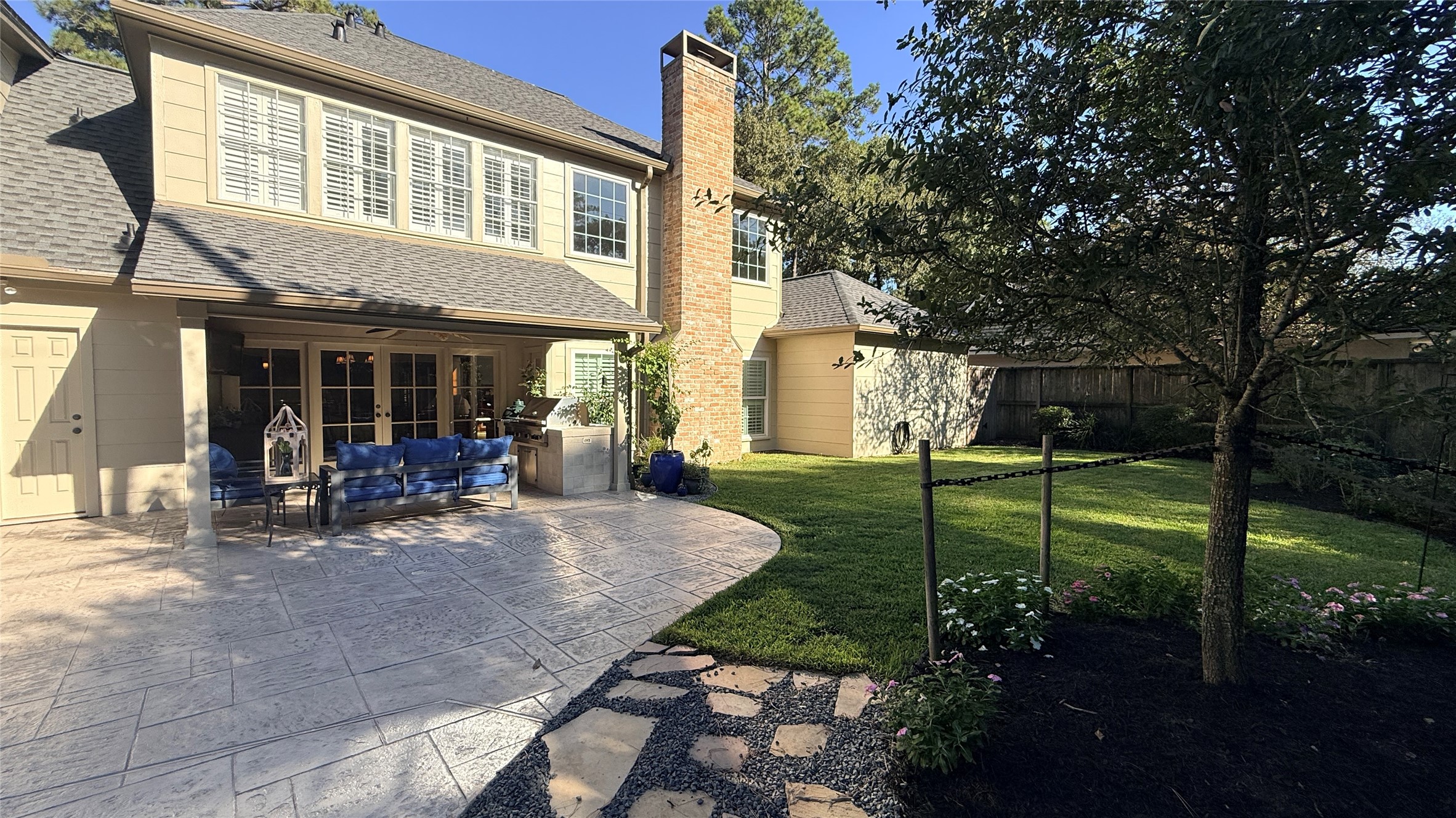 Spacious back yard with large patio.