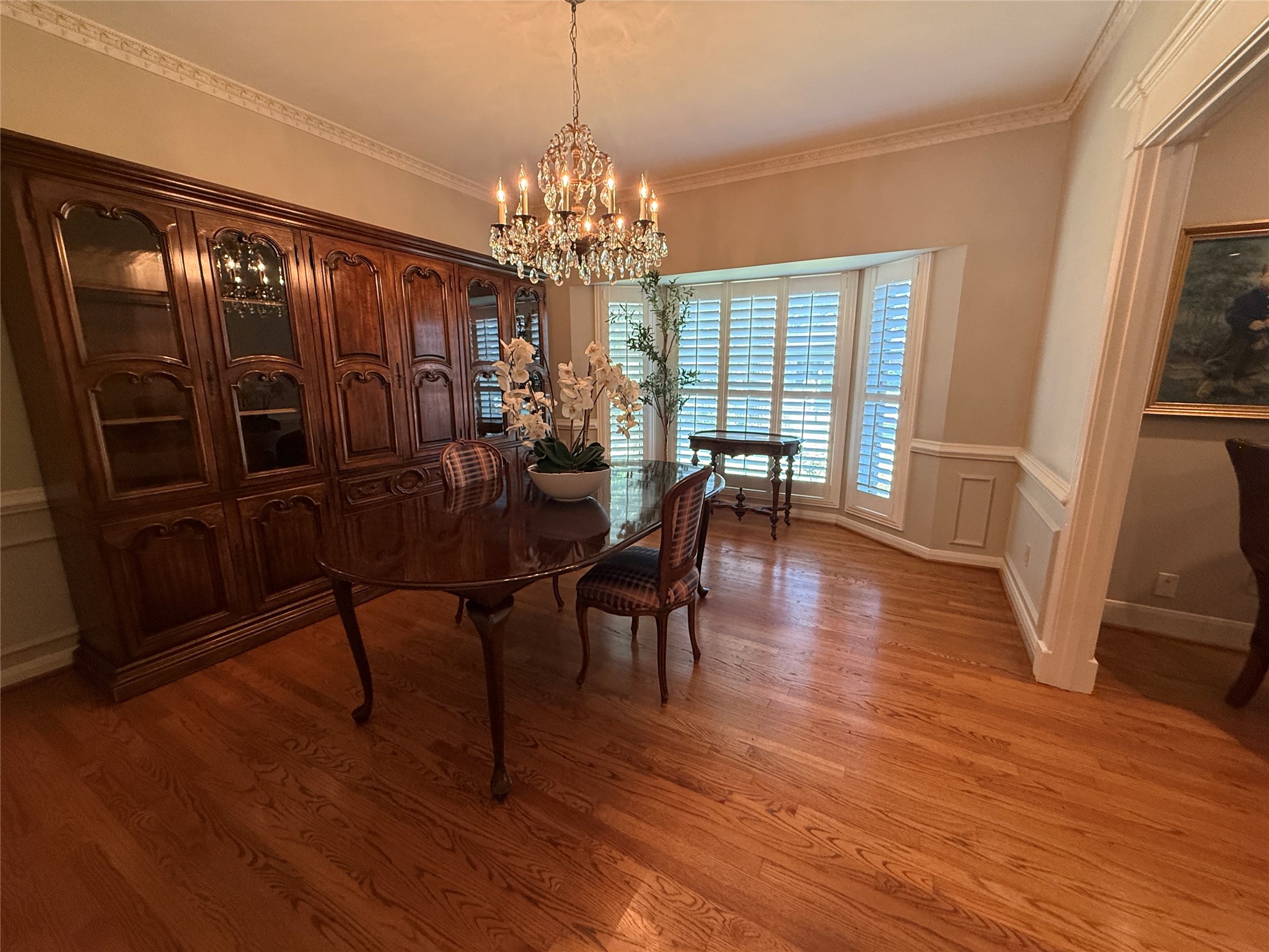Formal dining room with bay window and plantation shutters. Formal dining room with bay window and plantation shutters.