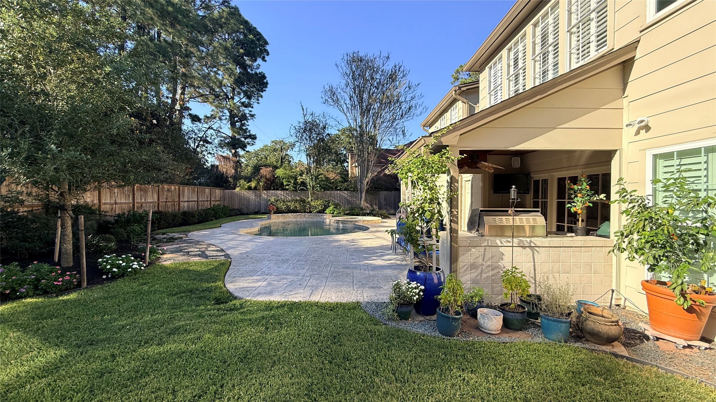 View of the pool and covered patio.