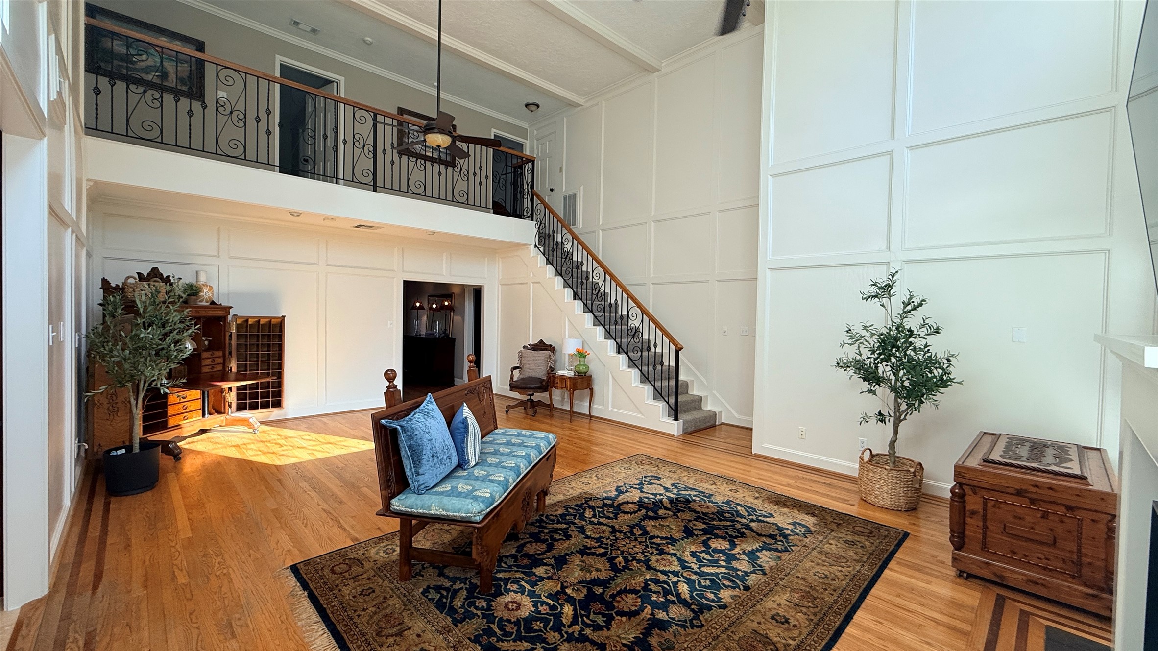 Family room with wrought iron stair railing. Family room with wrought iron stair railing.