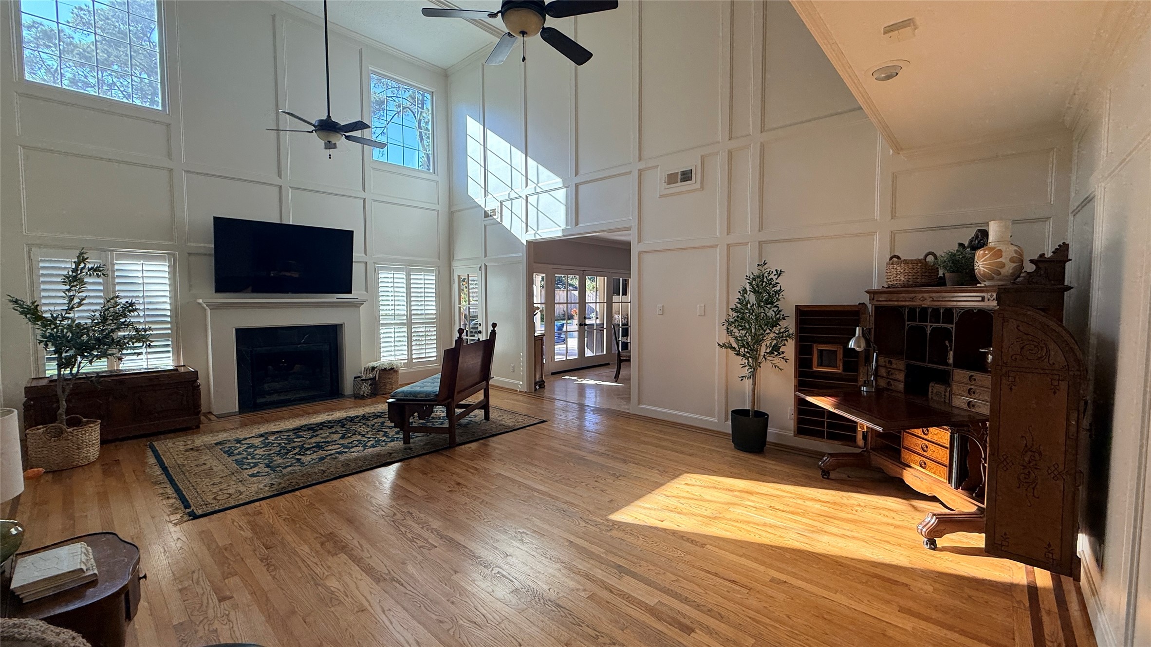 Den with vaulted ceiling and two story windows. Den with vaulted ceiling and two story windows.