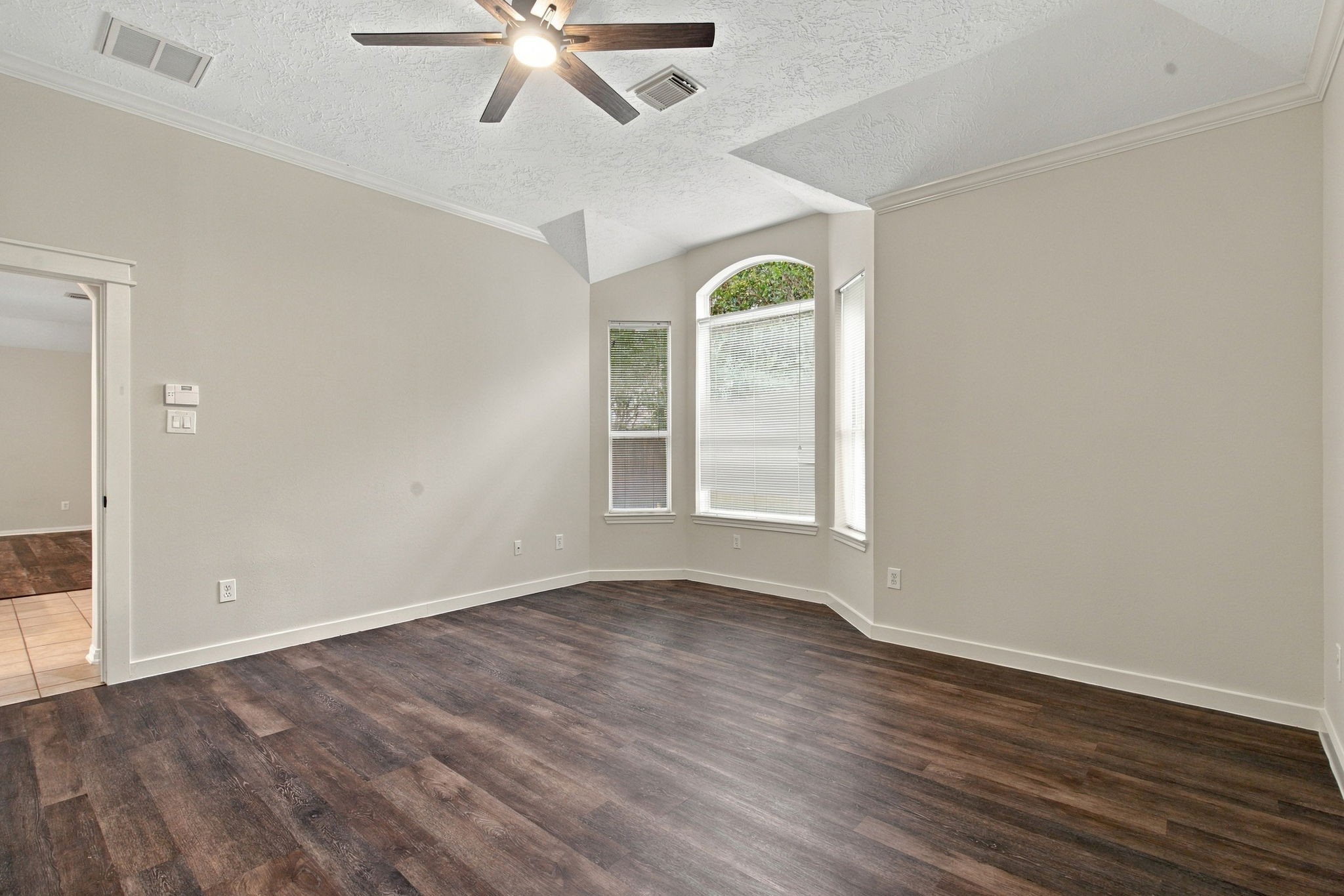 Additional view of this spacious primary bedroom with a private en suite.