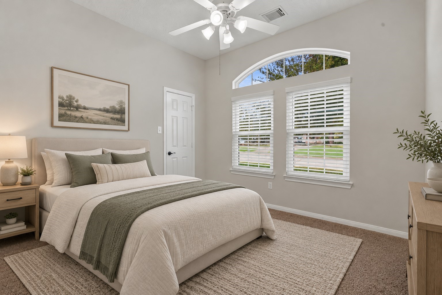 Secondary bedroom with views of the front yard. (Virtually Staged)