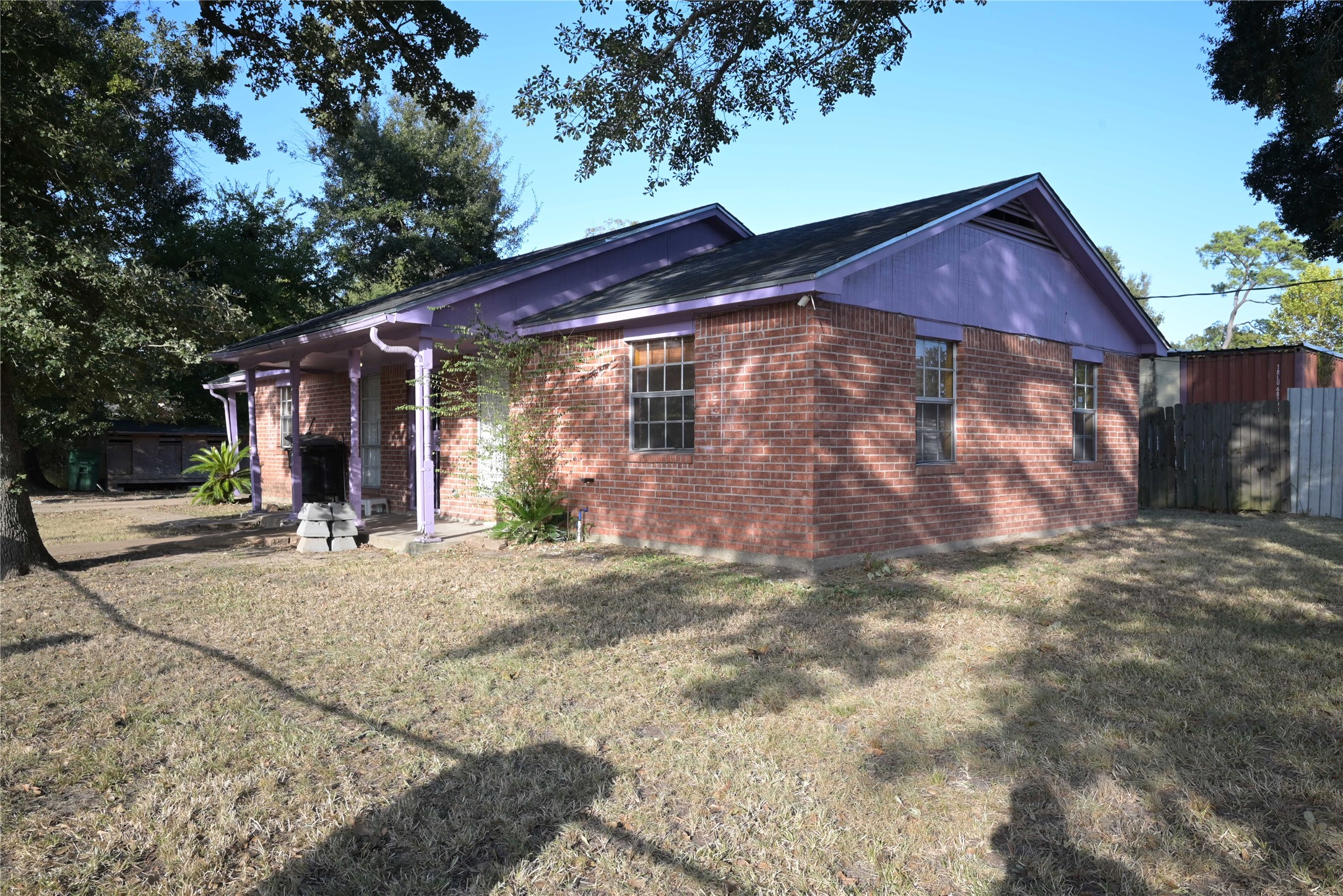 Classic brick charm on a generous corner lot shaded by mature trees