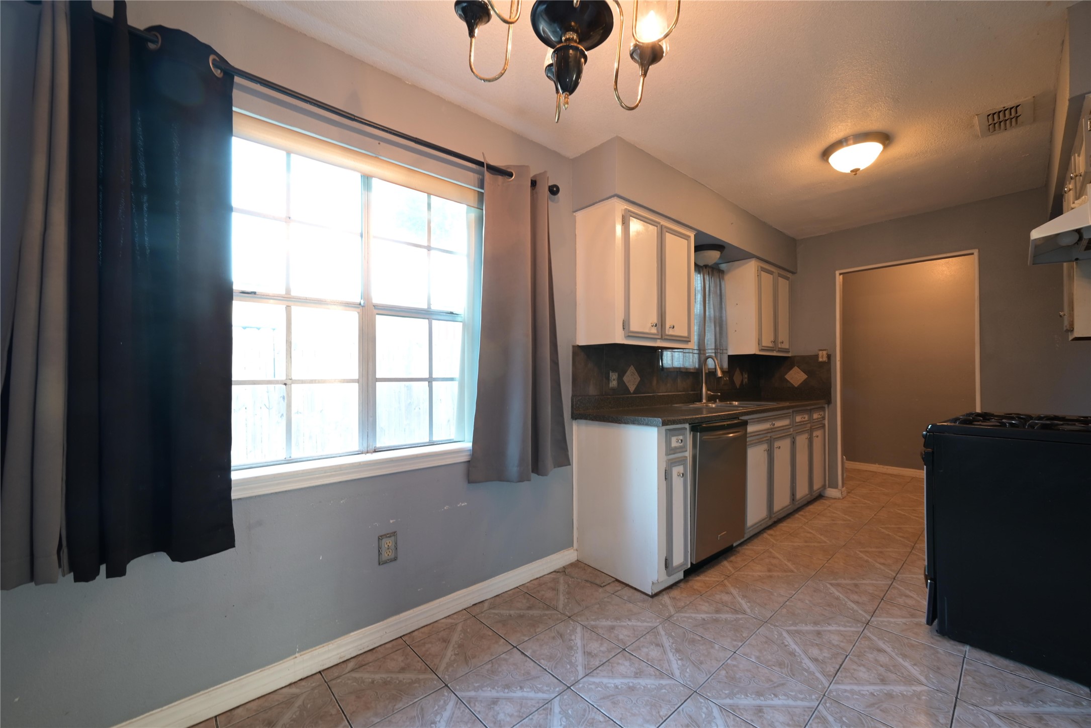 Granite countertops and a diamond-tile backsplash steal the show