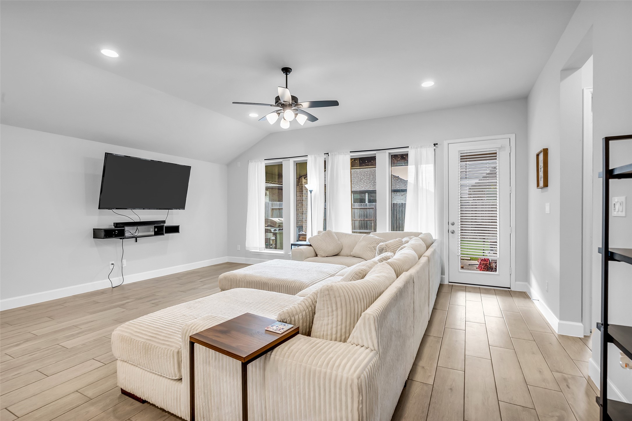 Your Spacious Living Room Complete w/ Large Windows & Full Length Glass Door For Providing Ample Natural Light, Perfect For Relaxing & Entertaining.