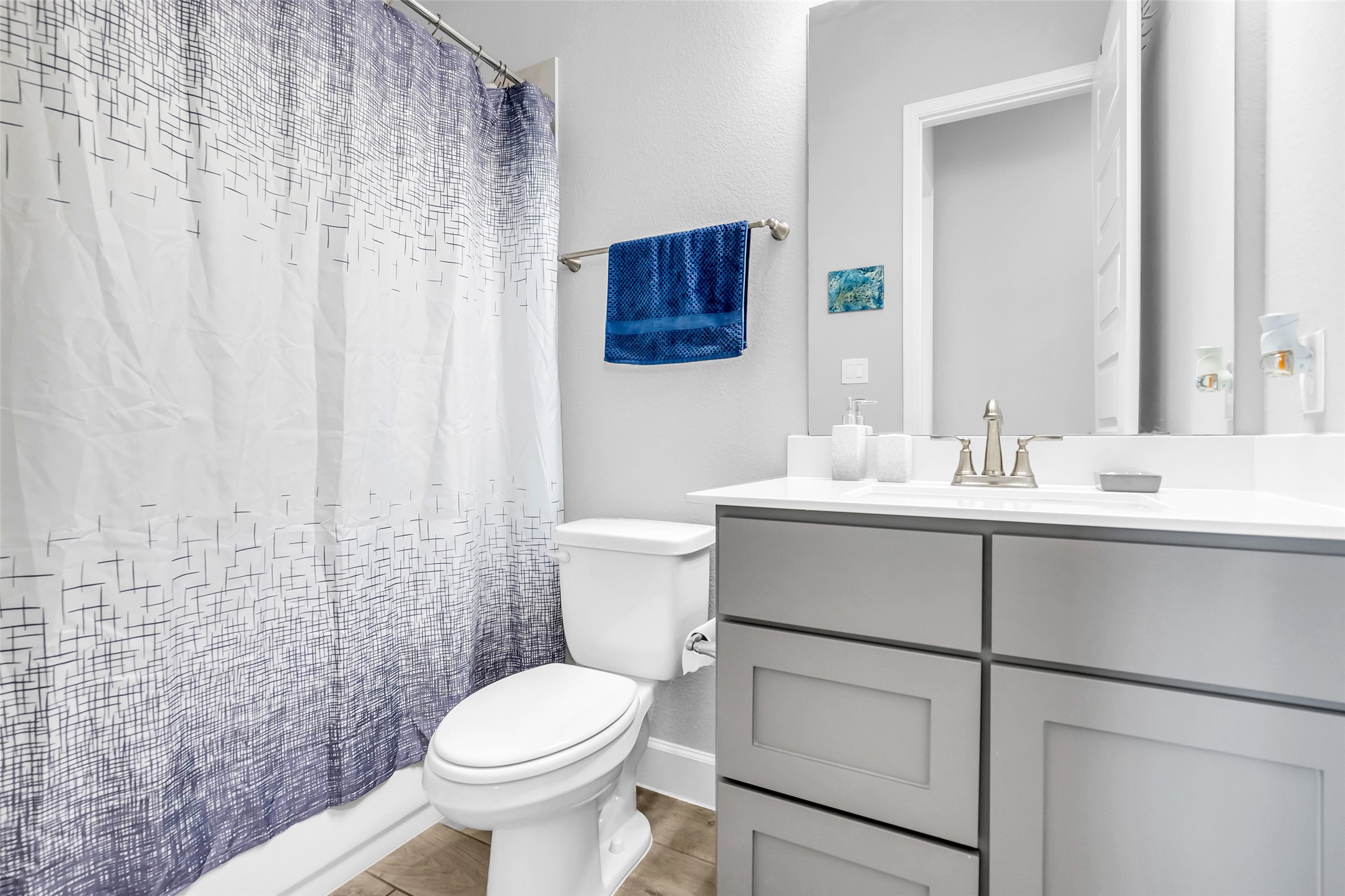 Secondary Bath #3 Featuring A Sleek Vanity & Stylish Fixtures